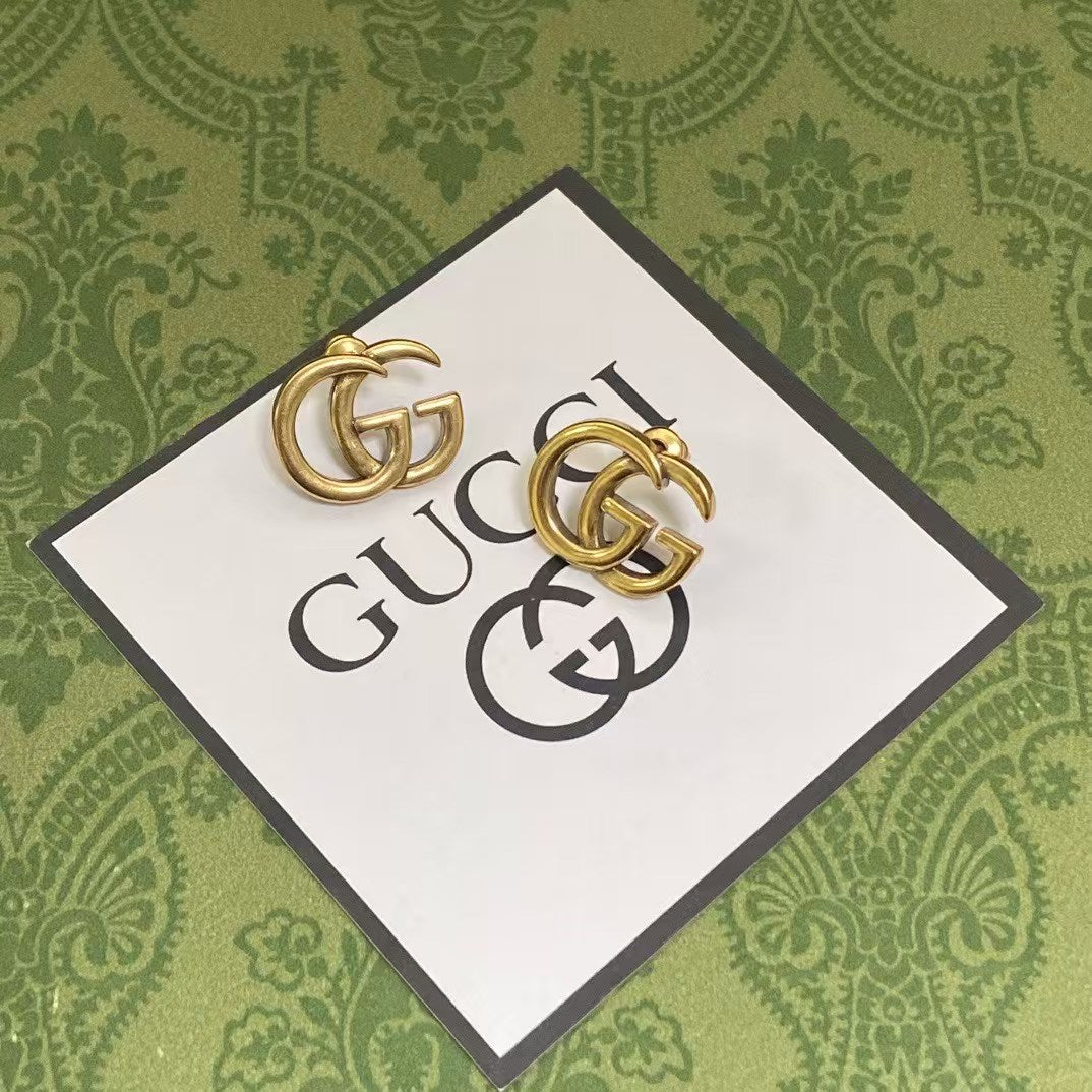 Gucci GG Logo Stud Earrings – Gold-Tone Interlocking GG Emblem