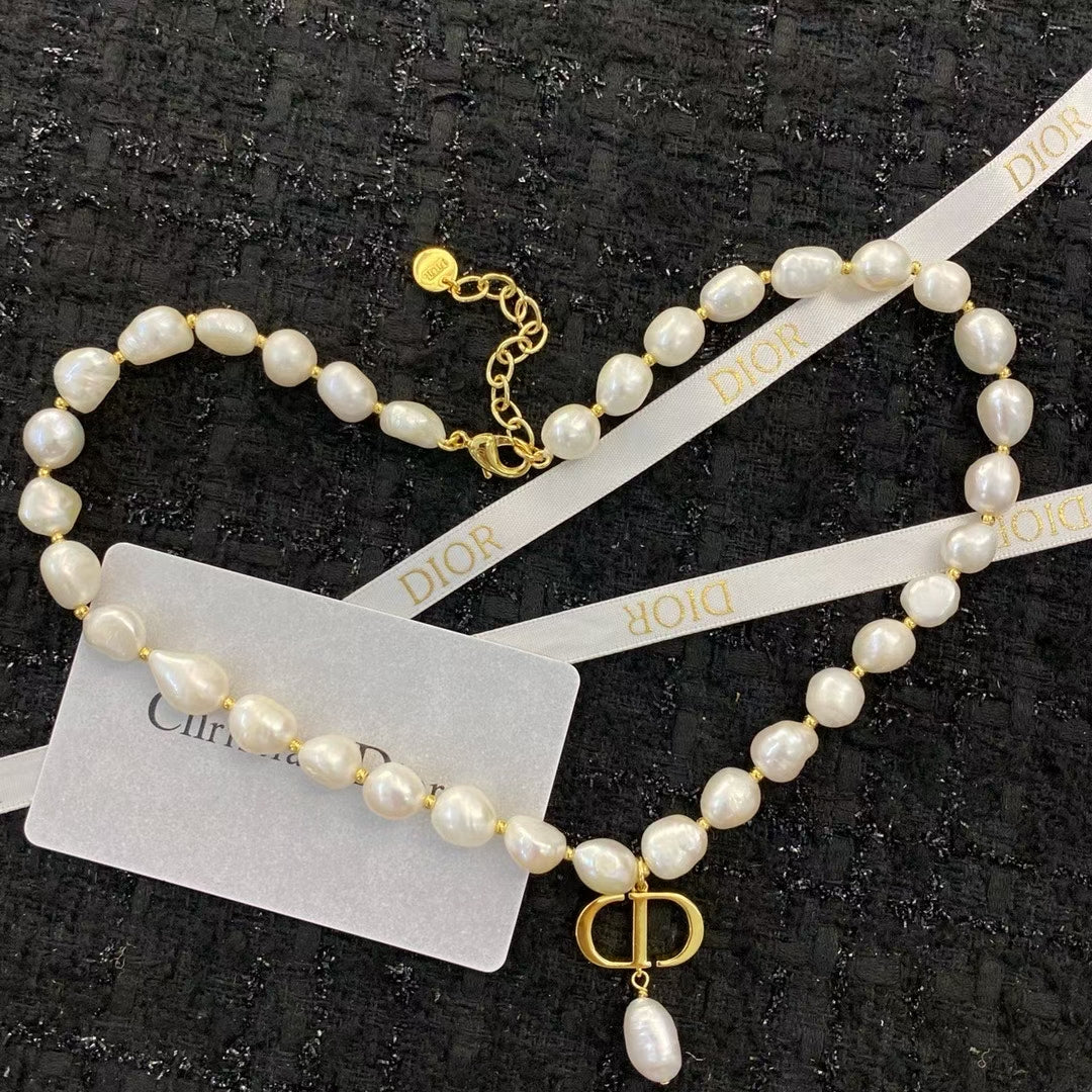 Christian Dior Pearl Necklace – Irregular White Pearls with Gold CD Pendant