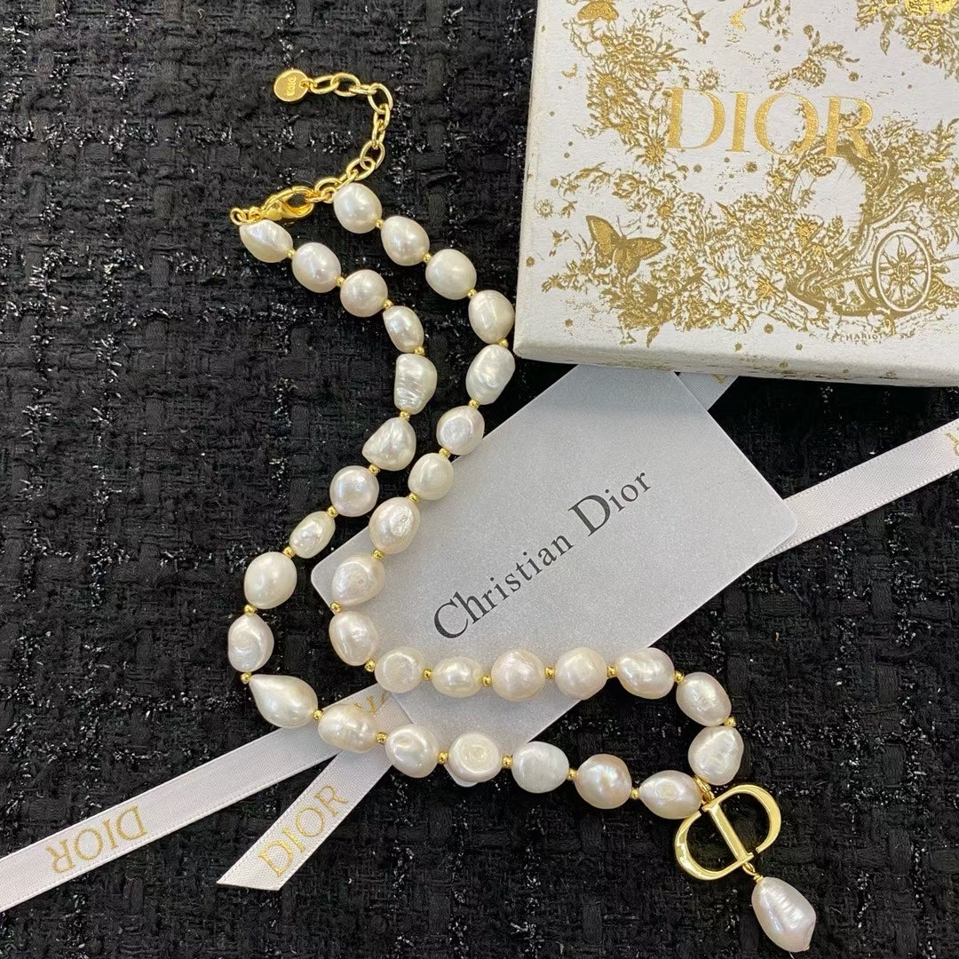Christian Dior Pearl Necklace – Irregular White Pearls with Gold CD Pendant