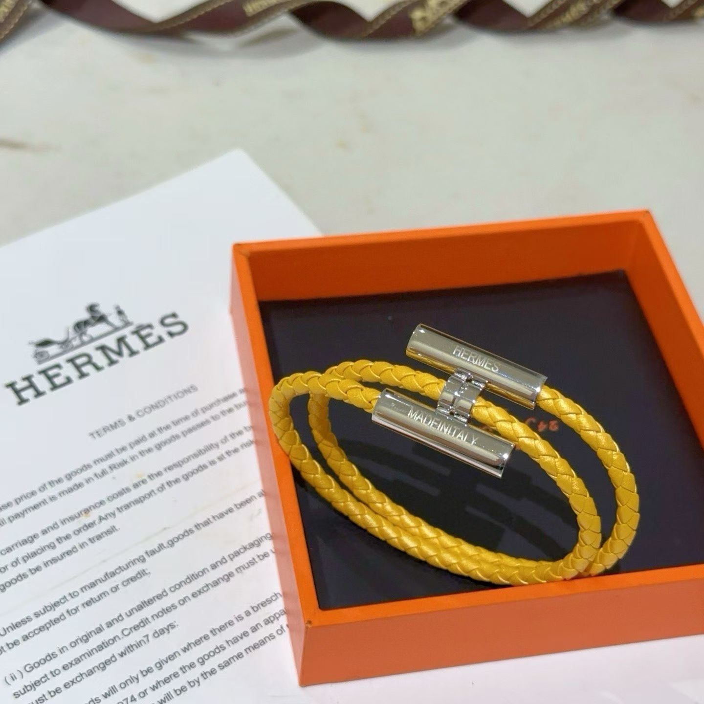 Hermès Tournis Tresse Bracelet Braided Leather with Engraved Metal Clasps
