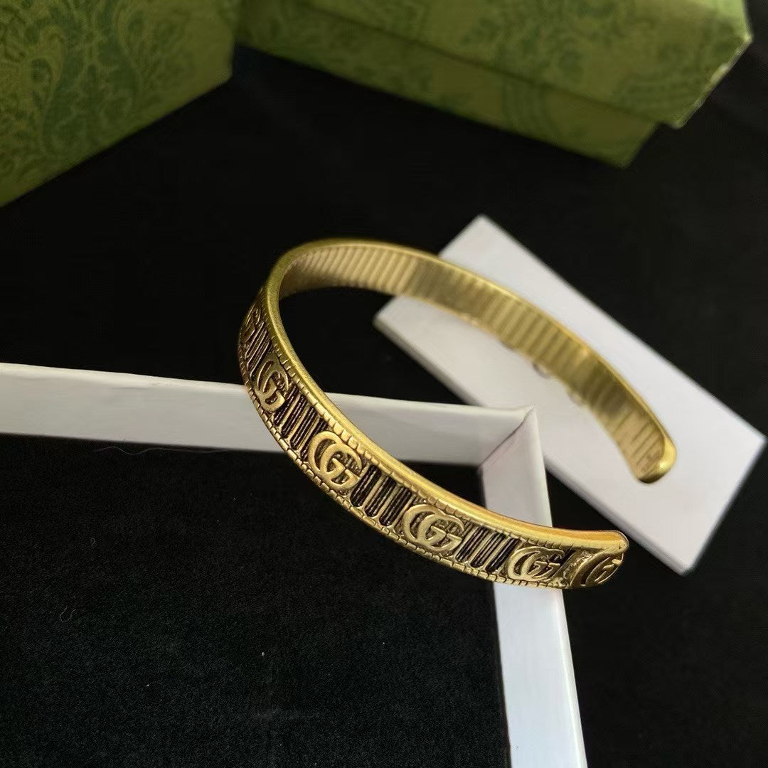Gucci Cuff Bracelet Double G Motif – Engraved Striped Gold Brass