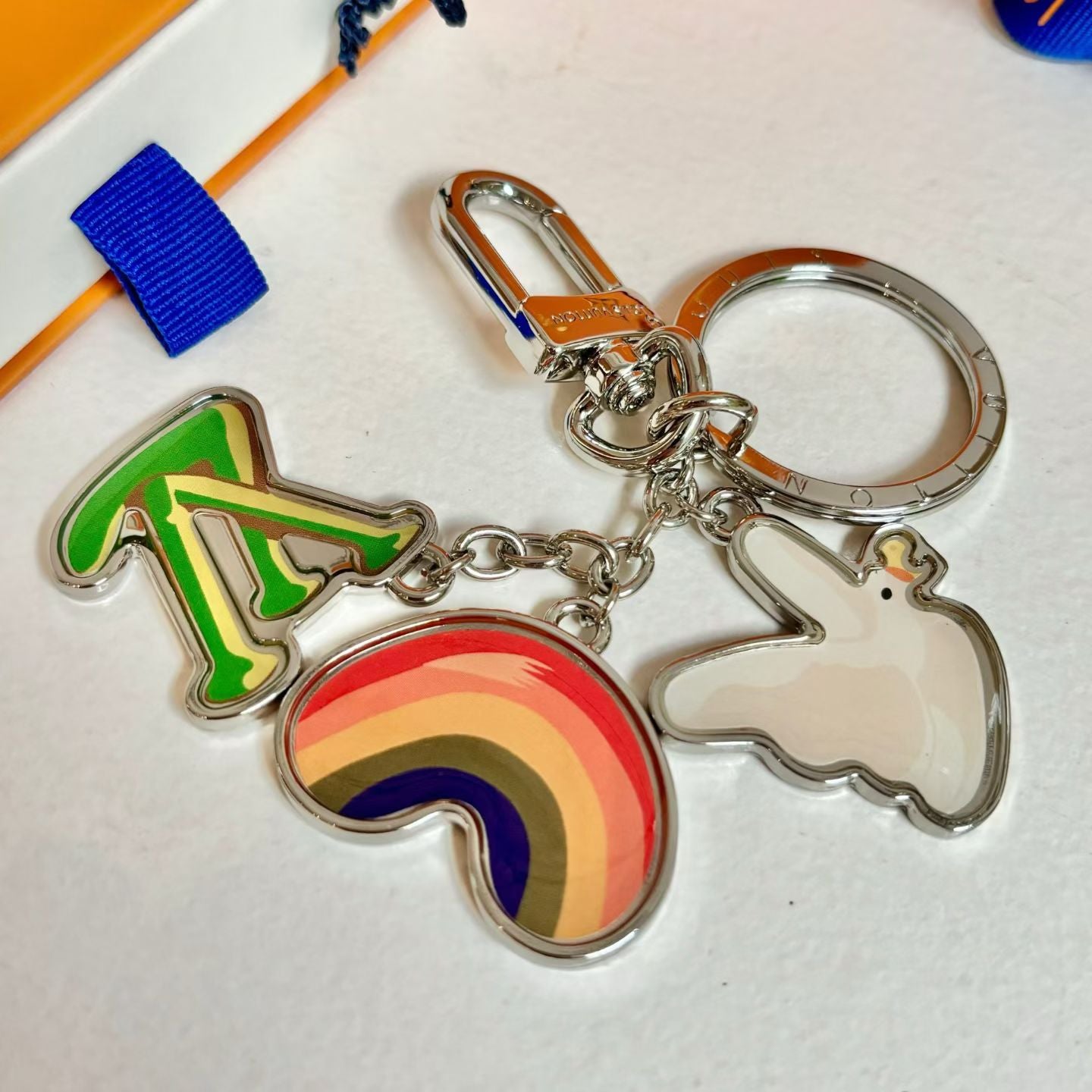 Louis Vuitton Rainbow Dove Keychain – Multicolor Charms with LV Logo