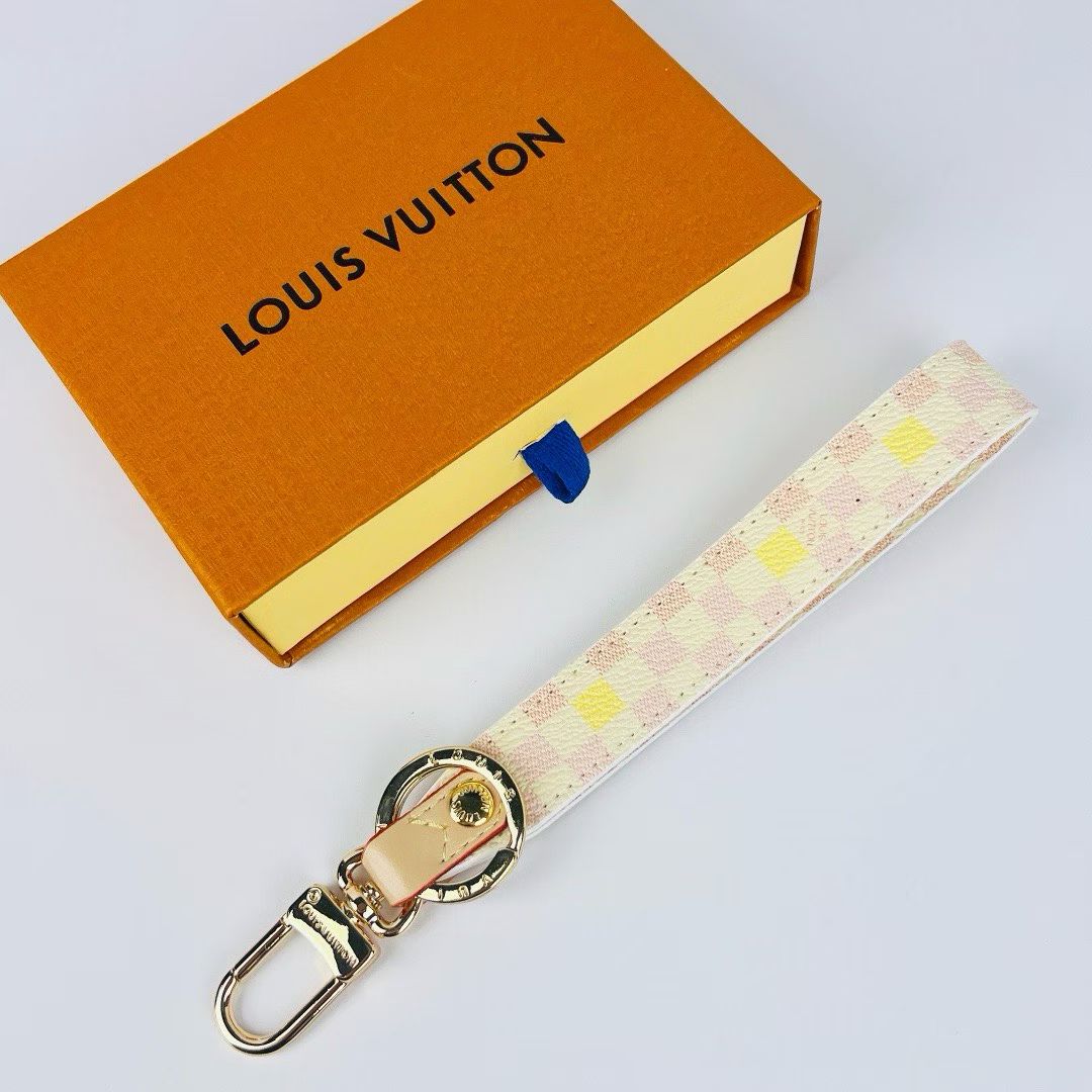 Louis Vuitton Monogram Wristlet Strap – Iconic Patterns & Gold-Toned Clasps