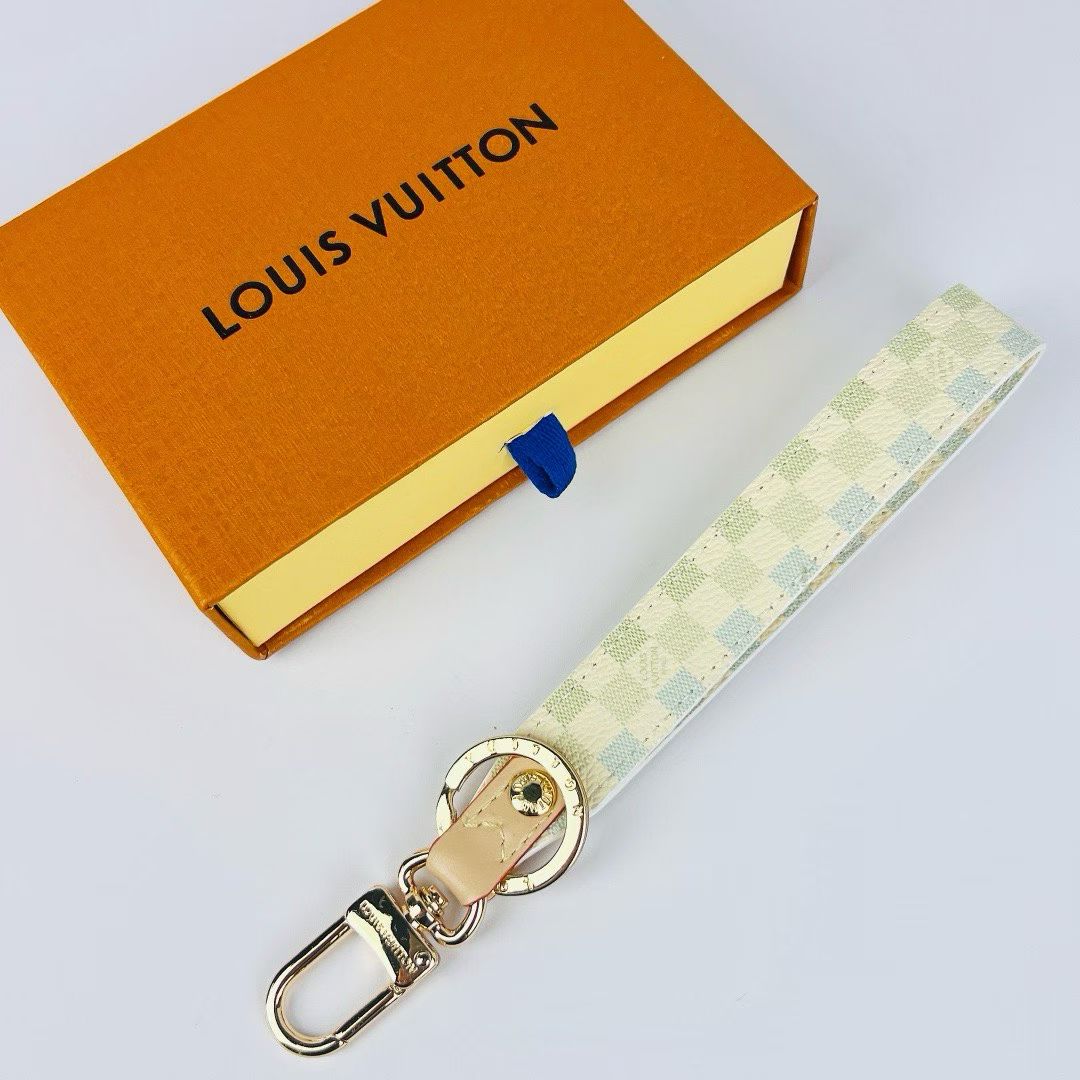 Louis Vuitton Monogram Wristlet Strap – Iconic Patterns & Gold-Toned Clasps