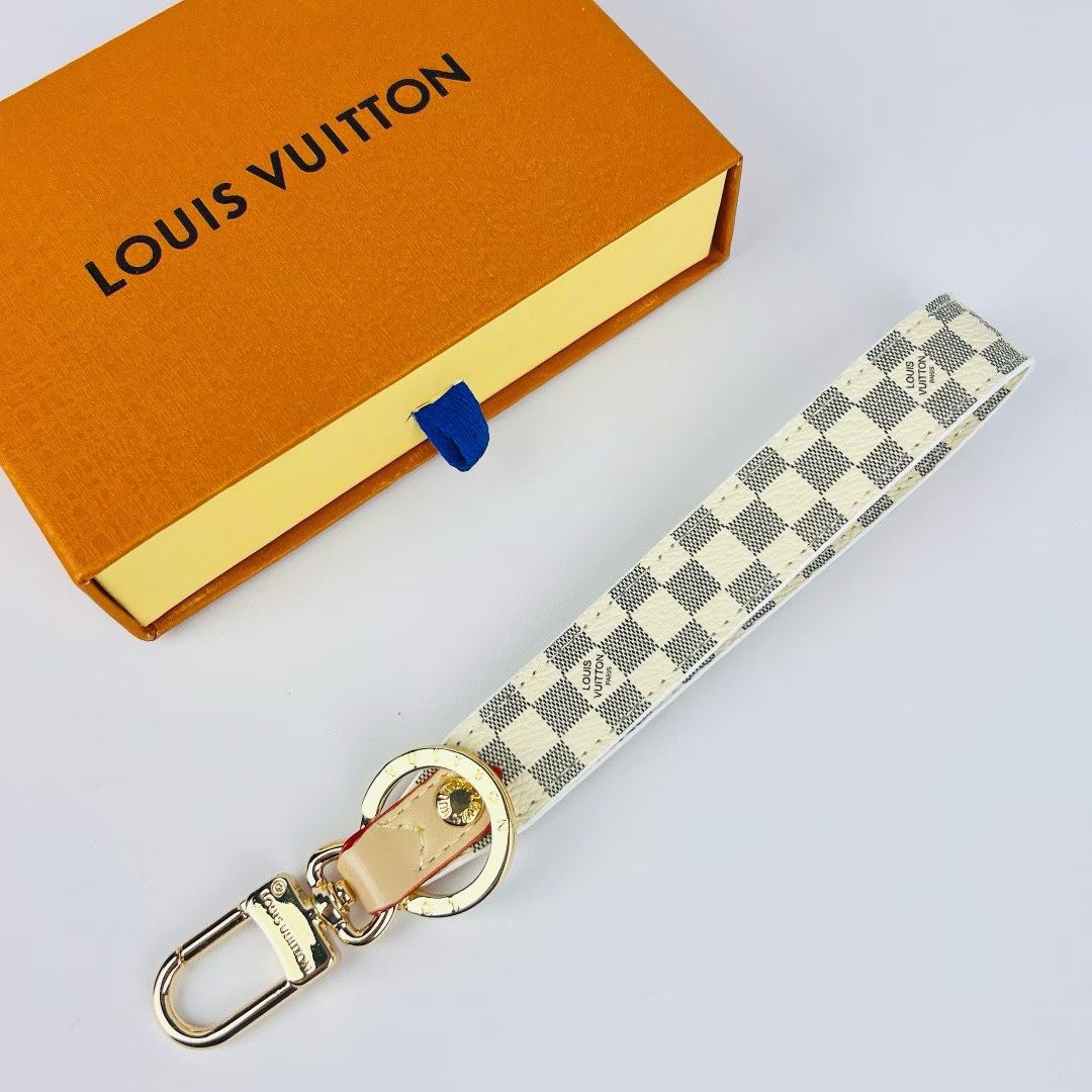 Louis Vuitton Monogram Wristlet Strap – Iconic Patterns & Gold-Toned Clasps
