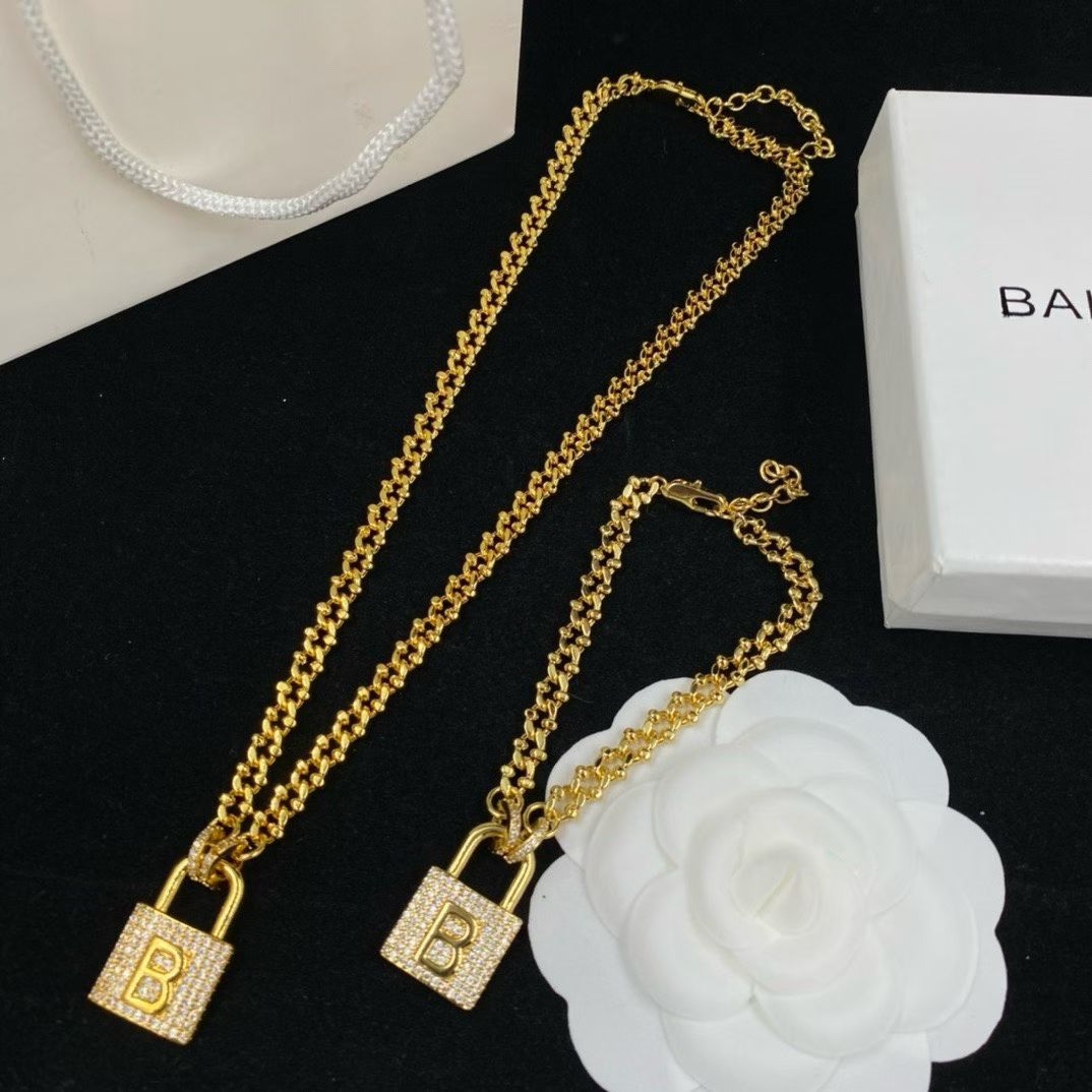 Balenciaga Padlock Jewelry – Gold Necklace & Bracelet Set
