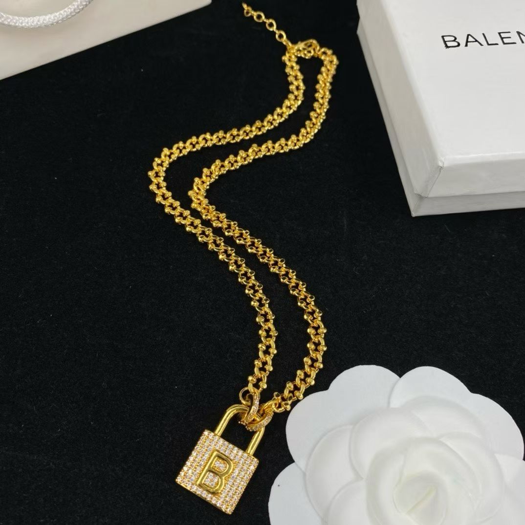 Balenciaga Padlock Jewelry – Gold Necklace & Bracelet Set