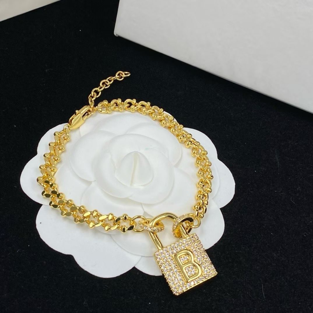 Balenciaga Padlock Jewelry – Gold Necklace & Bracelet Set