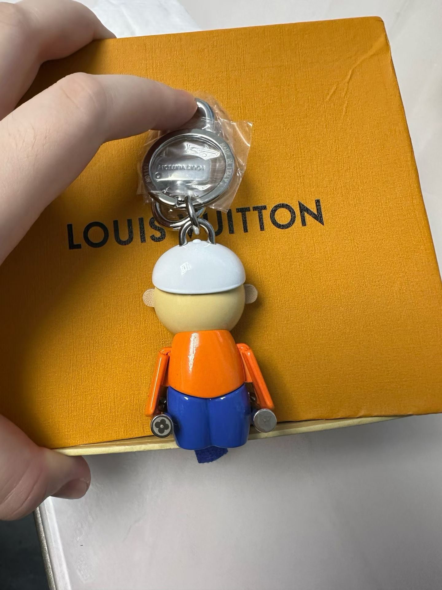 Louis Vuitton Street Style Character Keychain – White Cap, Orange Shirt & Blue Pants
