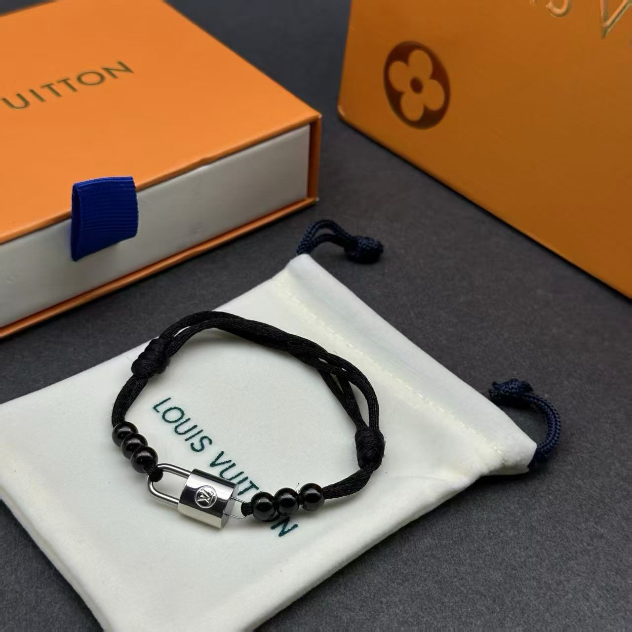 Louis Vuitton Lock Bead Cord Bracelet – Black Cord with Metallic Charm