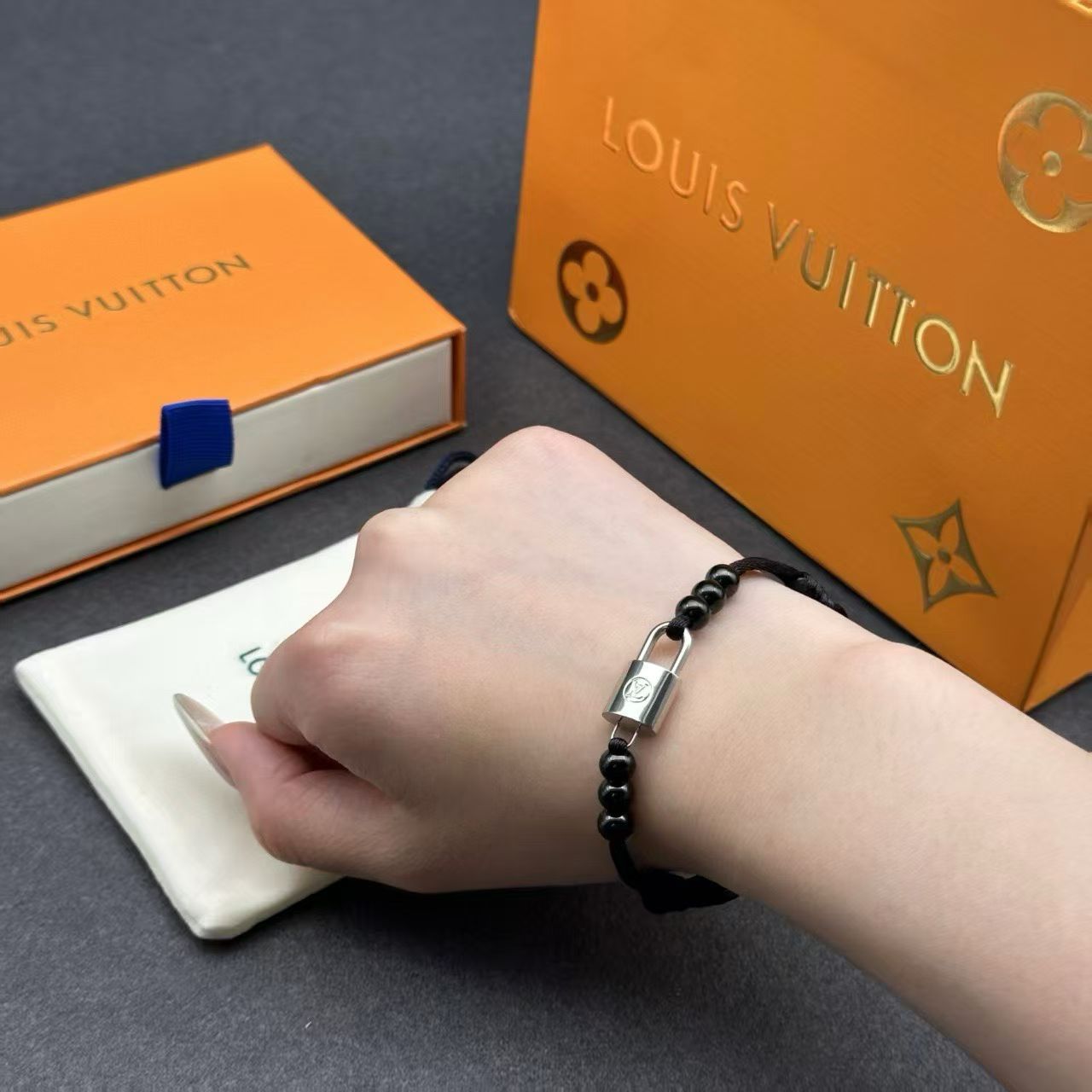 Louis Vuitton Lock Bead Cord Bracelet – Black Cord with Metallic Charm