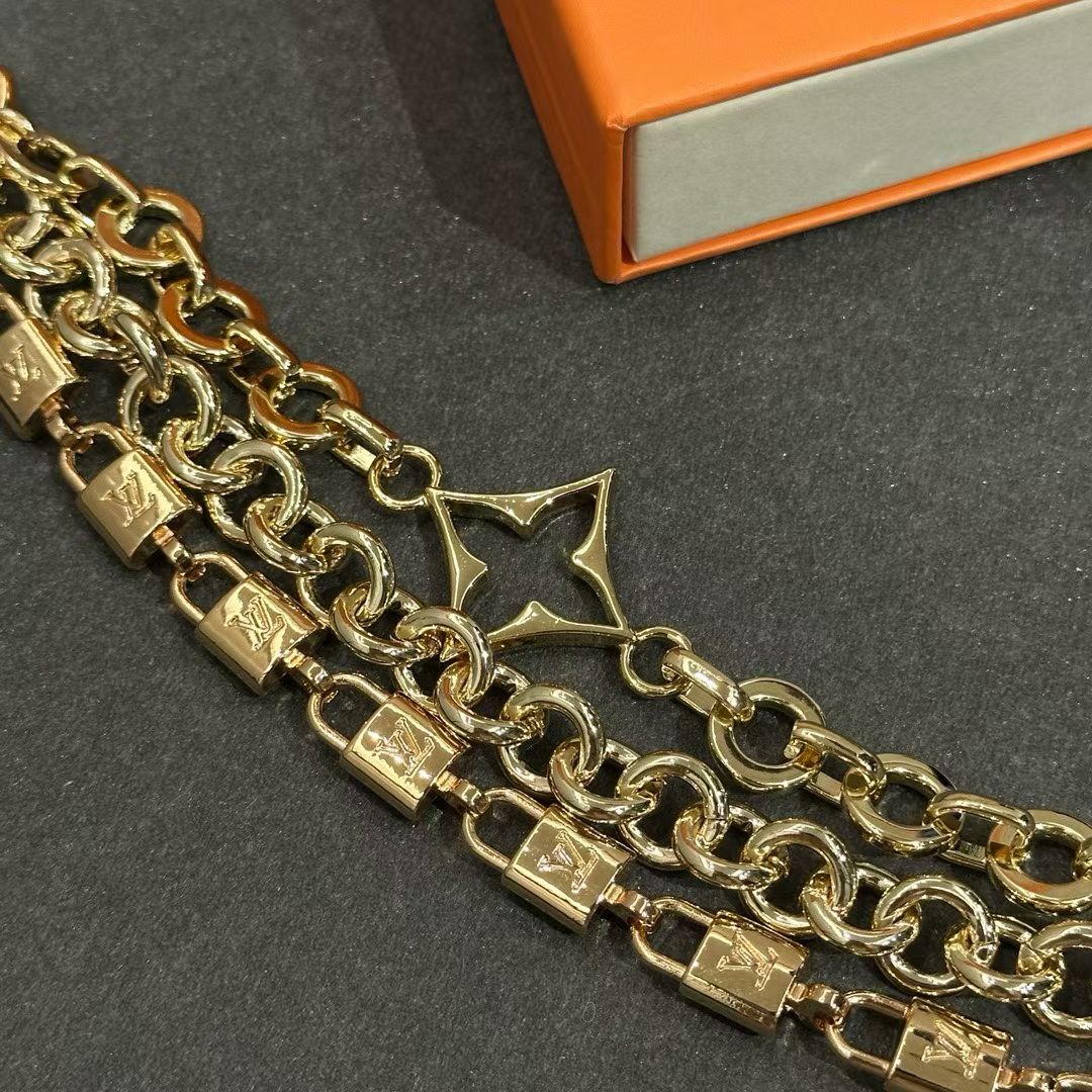 Louis Vuitton Triple-Strand Monogram Chain – Gold-Toned with Floral & Star Charms