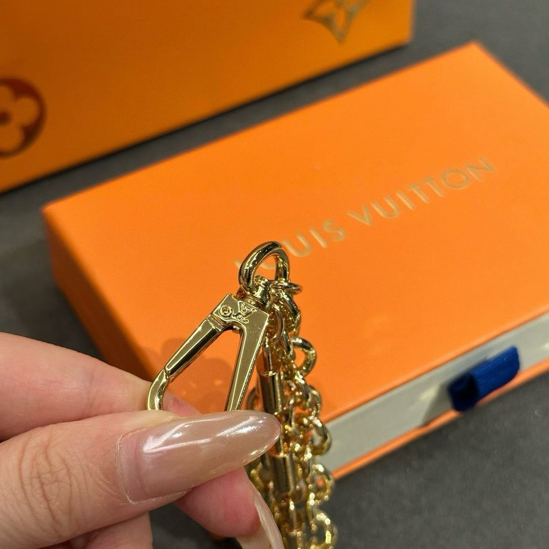 Louis Vuitton Triple-Strand Monogram Chain – Gold-Toned with Floral & Star Charms