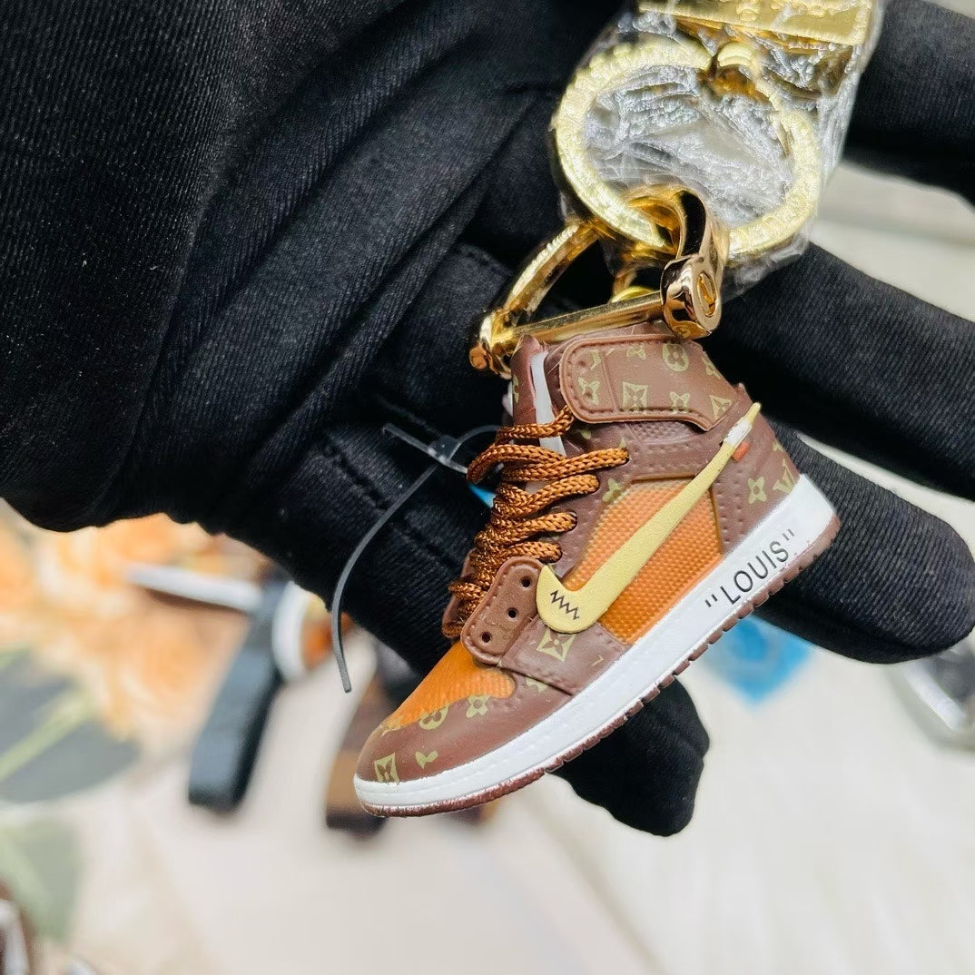 Louis Vuitton Sneaker Keychain – Brown & Orange High-Top with Monogram Detail