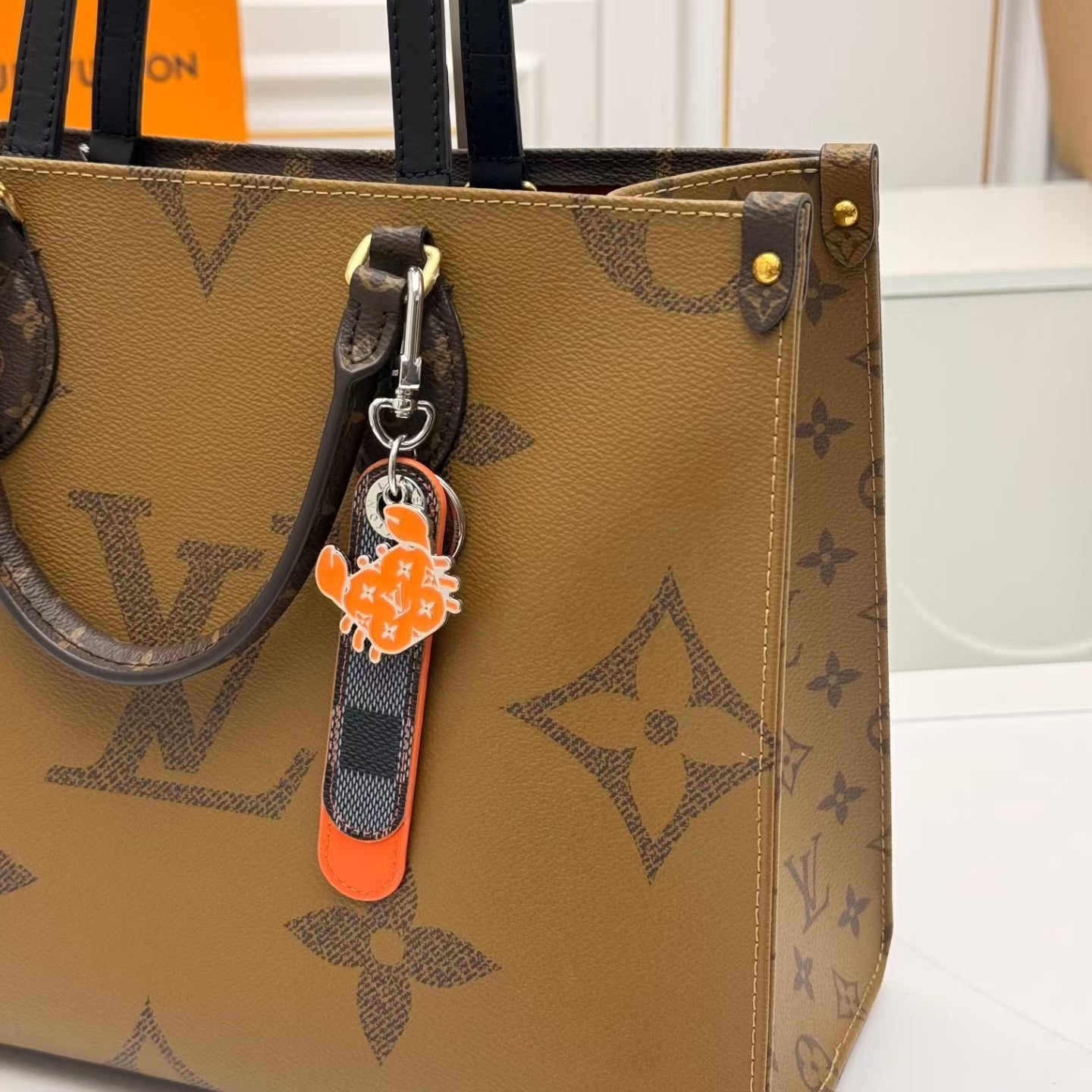 Louis Vuitton Crab Charm Keychain – Monogram Leather Strap with Silver & Orange Crabs