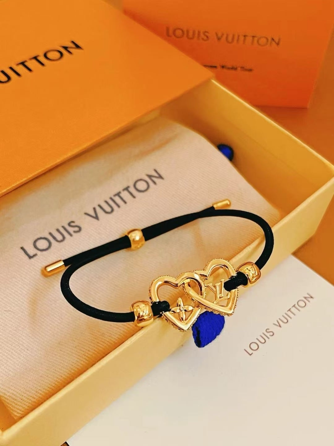 Louis Vuitton Interlocking Heart Cord Bracelet – Black, Red, Blue & Orange