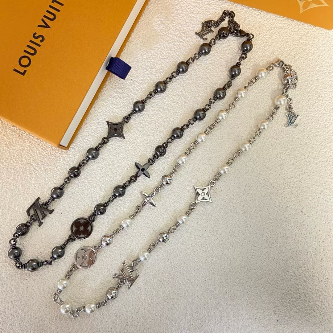 Louis Vuitton Engraved Link Jewelry Set – Silver Necklace & Bracelet with Symbolic Motifs