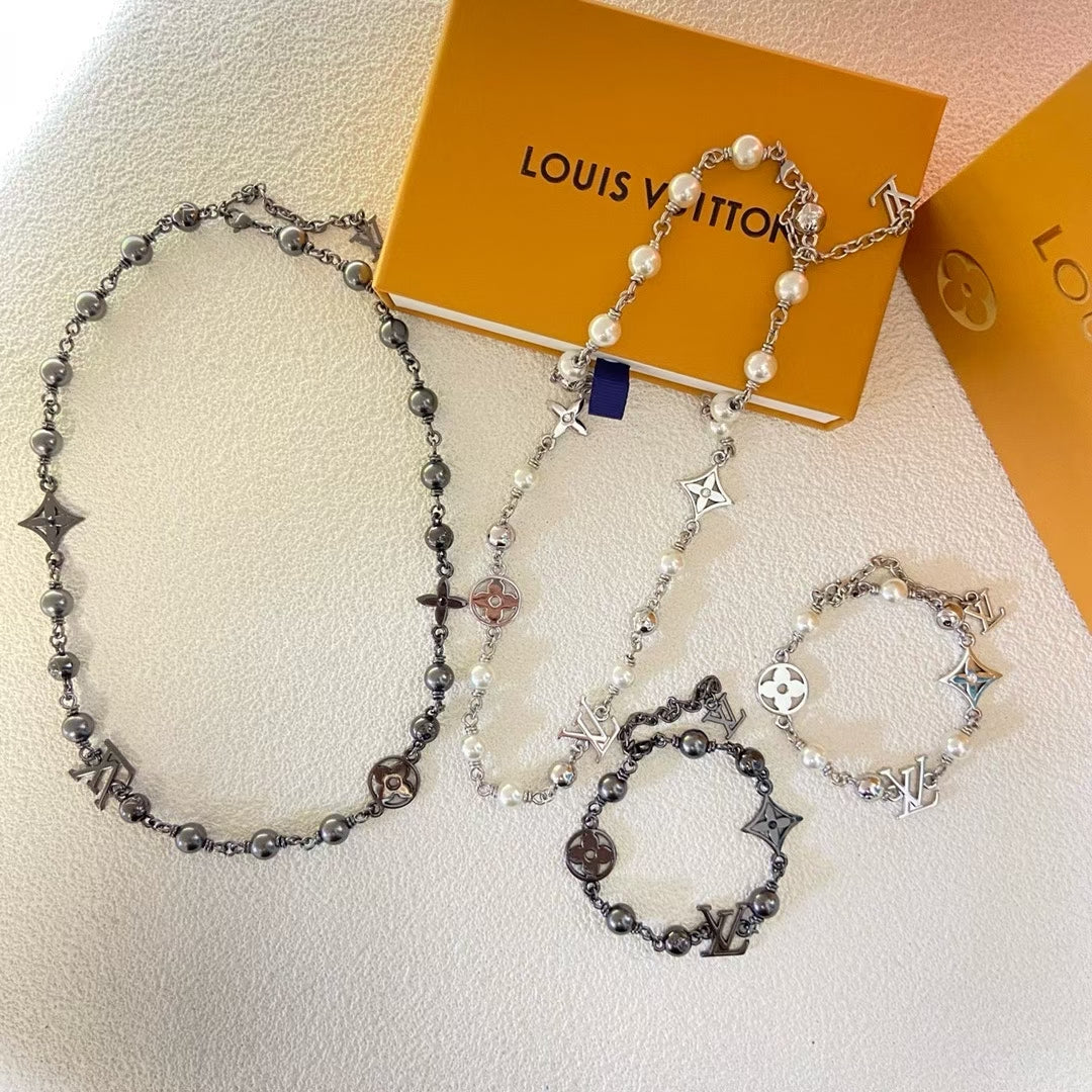 Louis Vuitton Engraved Link Jewelry Set – Silver Necklace & Bracelet with Symbolic Motifs