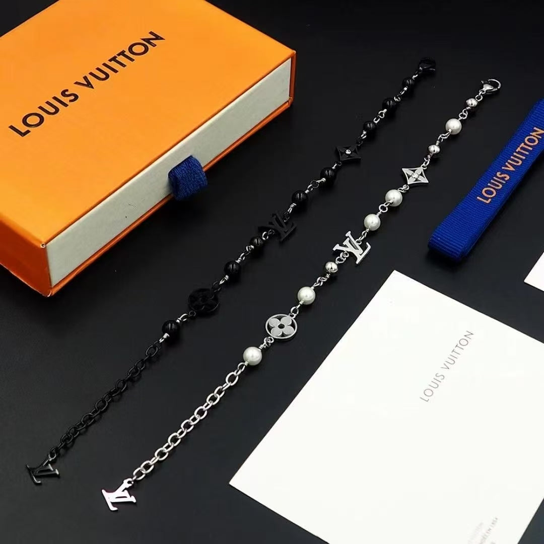 Louis Vuitton Engraved Link Jewelry Set – Silver Necklace & Bracelet with Symbolic Motifs