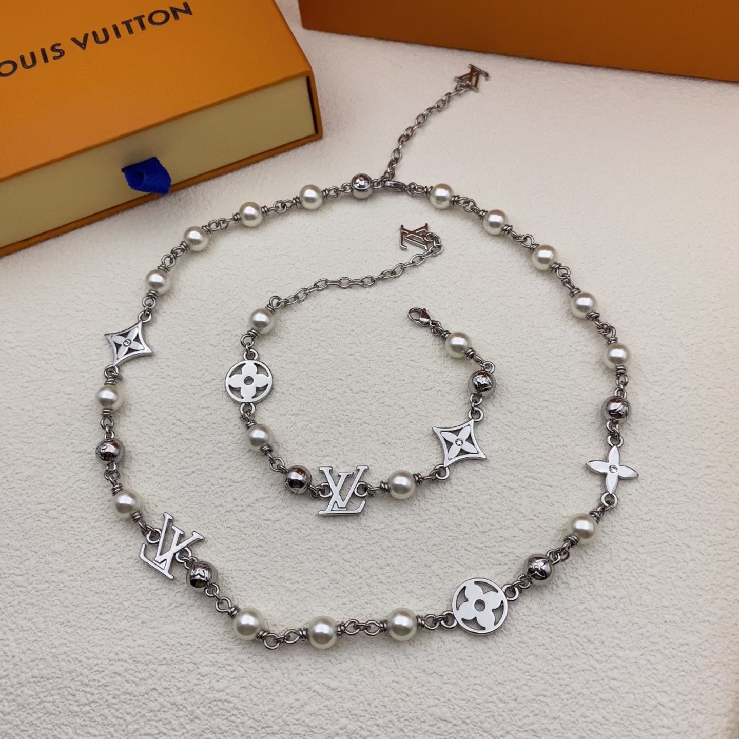 Louis Vuitton Engraved Link Jewelry Set – Silver Necklace & Bracelet with Symbolic Motifs