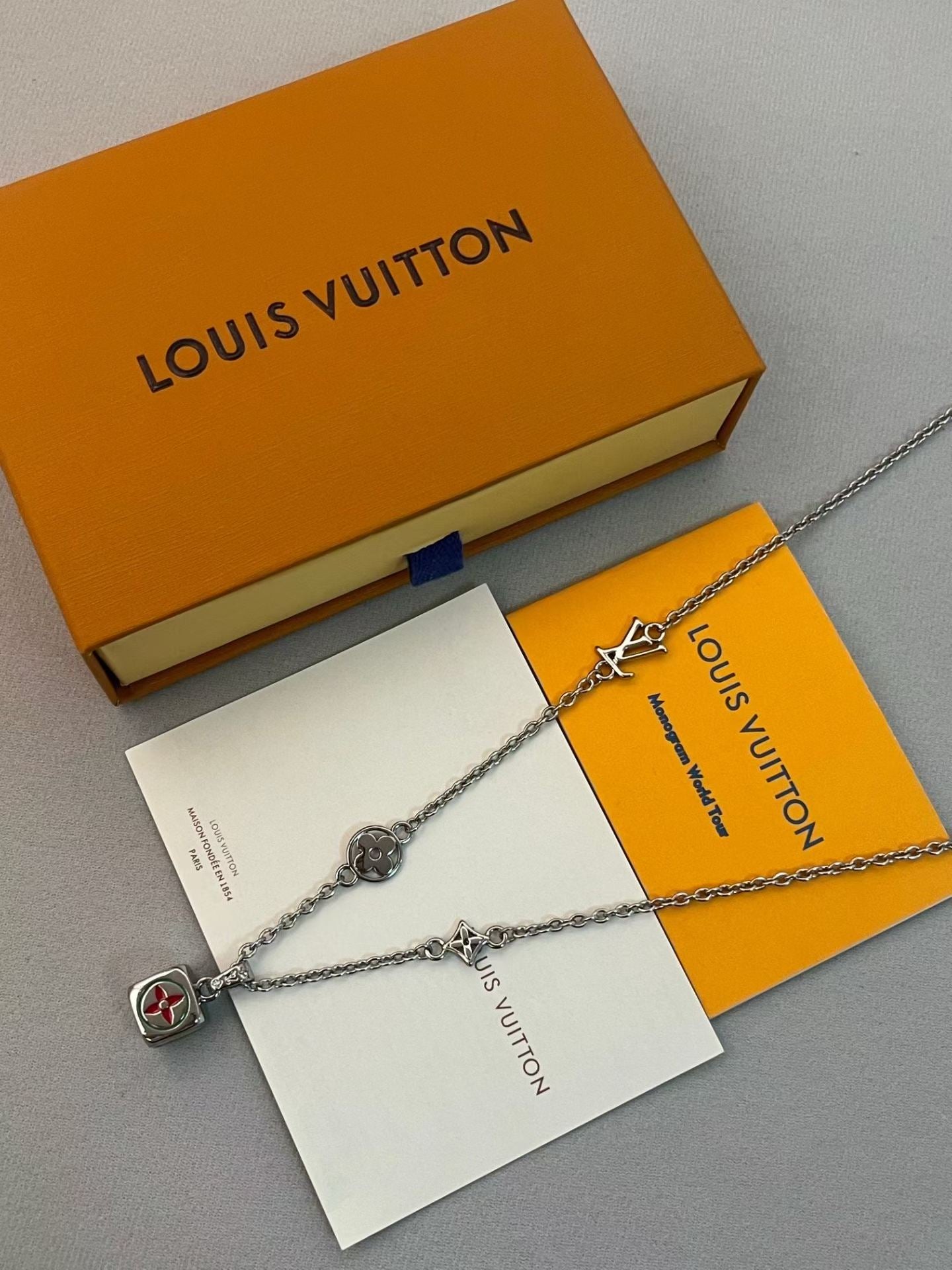 Louis Vuitton Charm Cluster Necklace – Silver Chain with LV Cube & Star Motifs