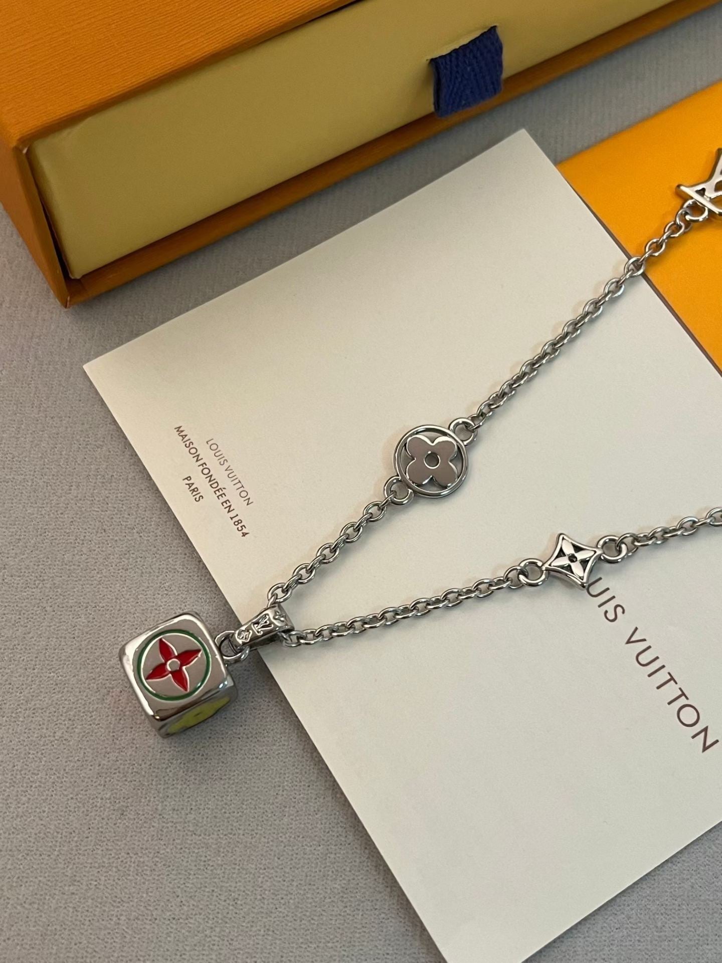 Louis Vuitton Charm Cluster Necklace – Silver Chain with LV Cube & Star Motifs