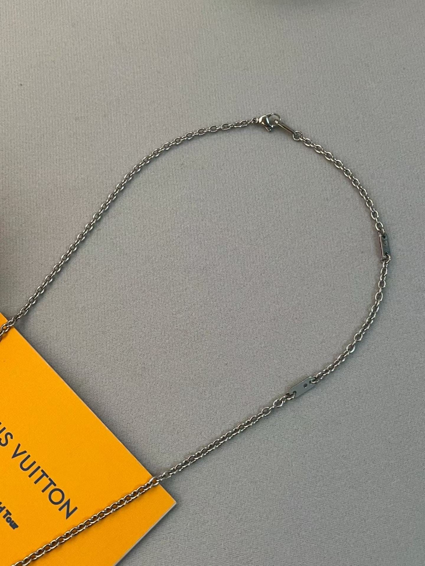 Louis Vuitton Signature Charm Necklace – Silver Chain with LV Logo & Motifs