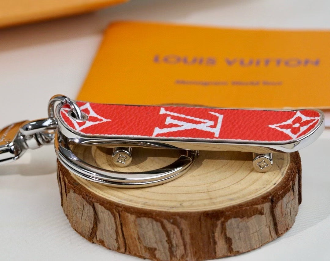 Louis Vuitton Monogram Leather Tag Keychain – Classic Brown & Gold