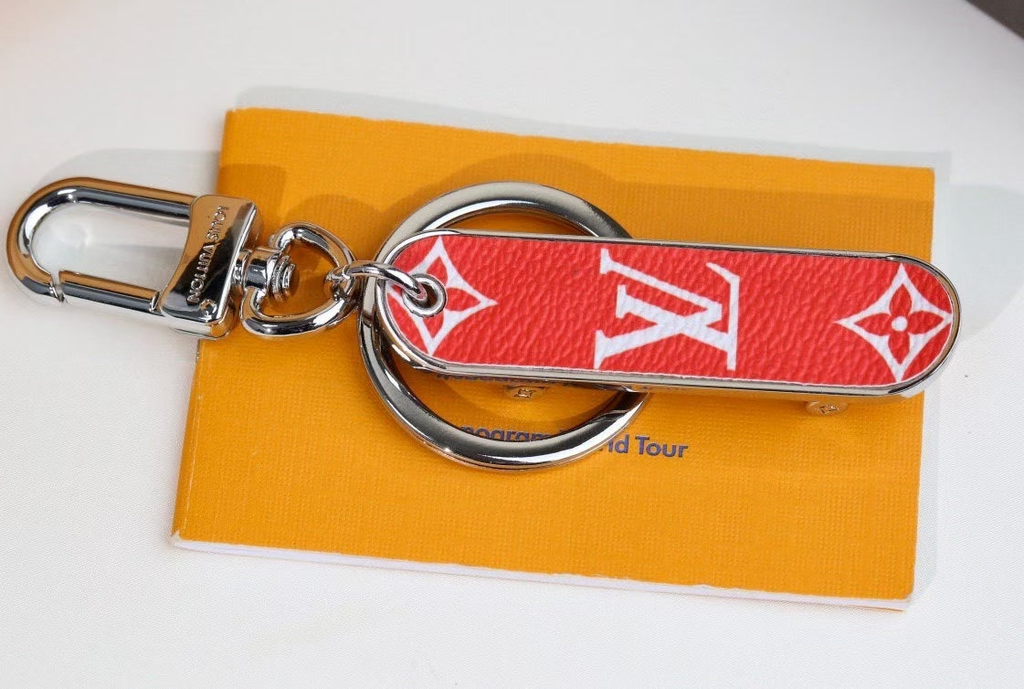 Louis Vuitton Monogram Leather Tag Keychain – Classic Brown & Gold