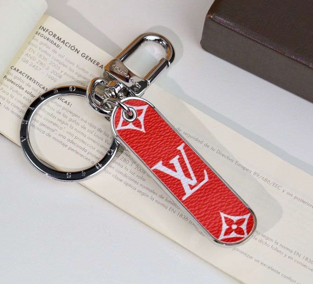 Louis Vuitton Monogram Leather Tag Keychain – Classic Brown & Gold