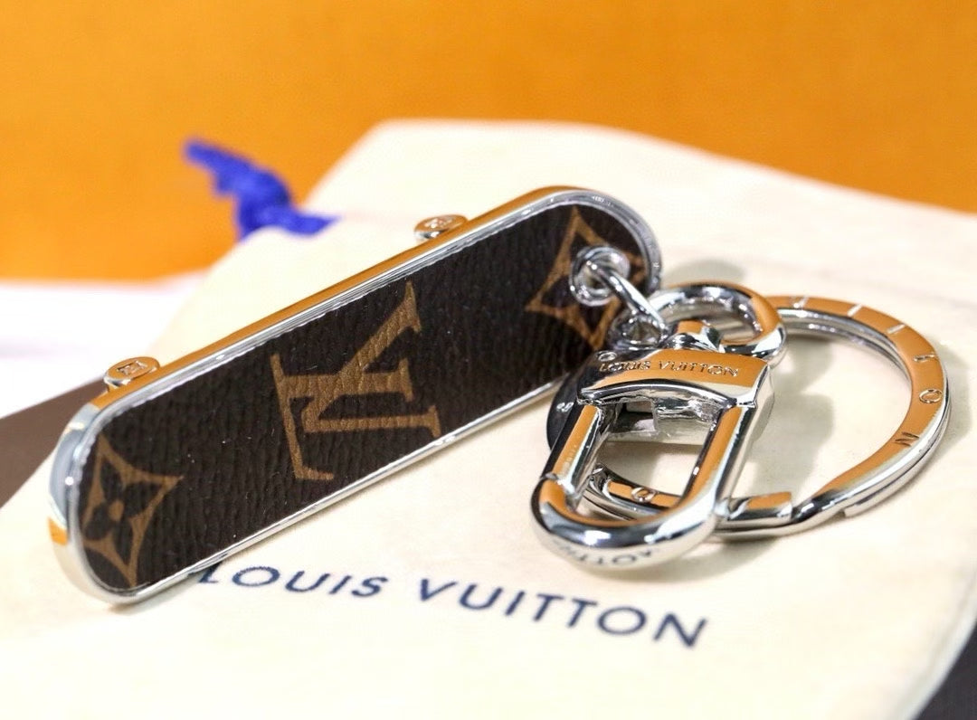 Louis Vuitton Monogram Leather Tag Keychain – Classic Brown & Gold