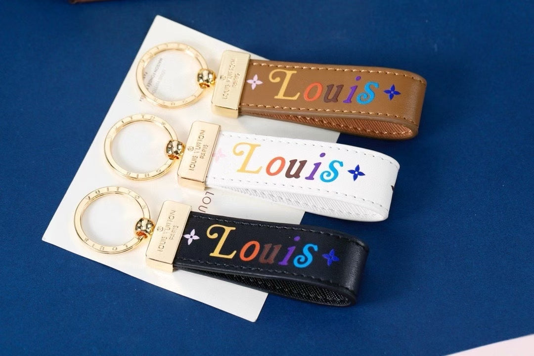 Louis Vuitton Multicolor “Louis” Keychain – Brown, White & Black Leather Straps