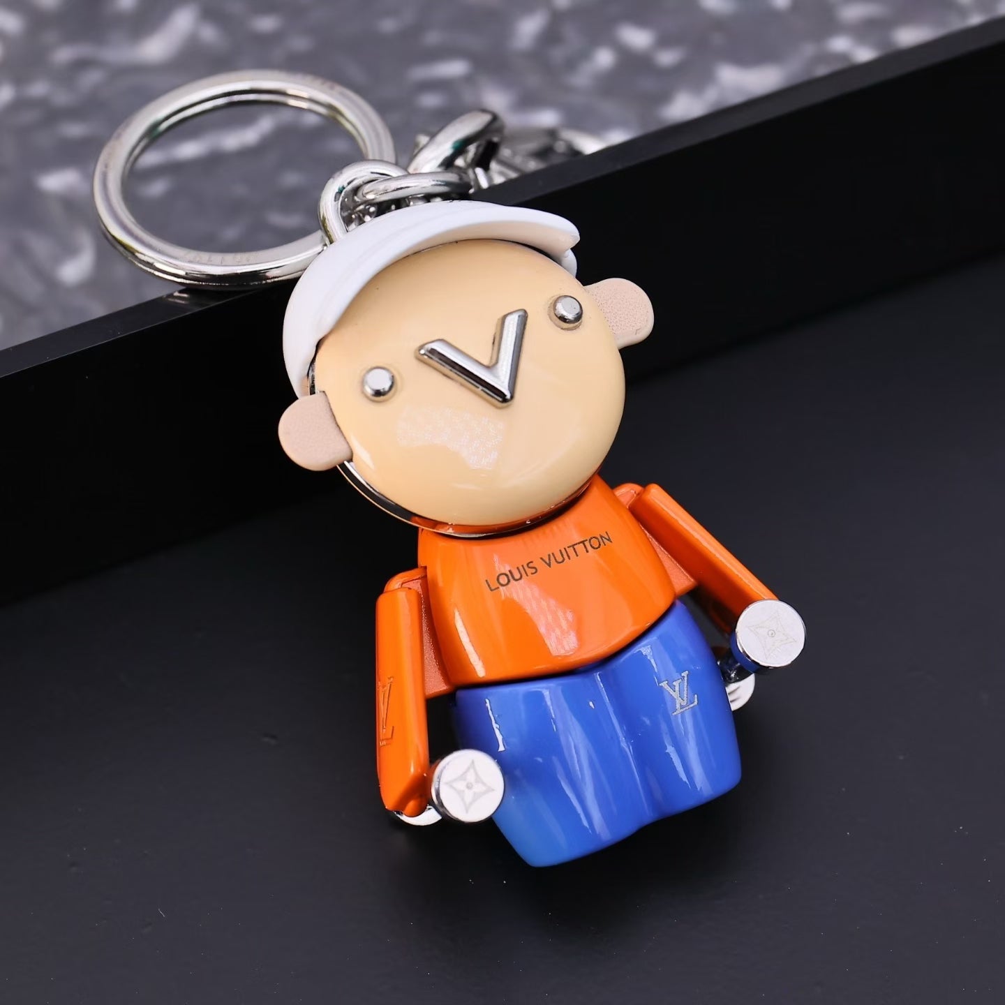 Louis Vuitton Street Style Character Keychain – White Cap, Orange Shirt & Blue Pants