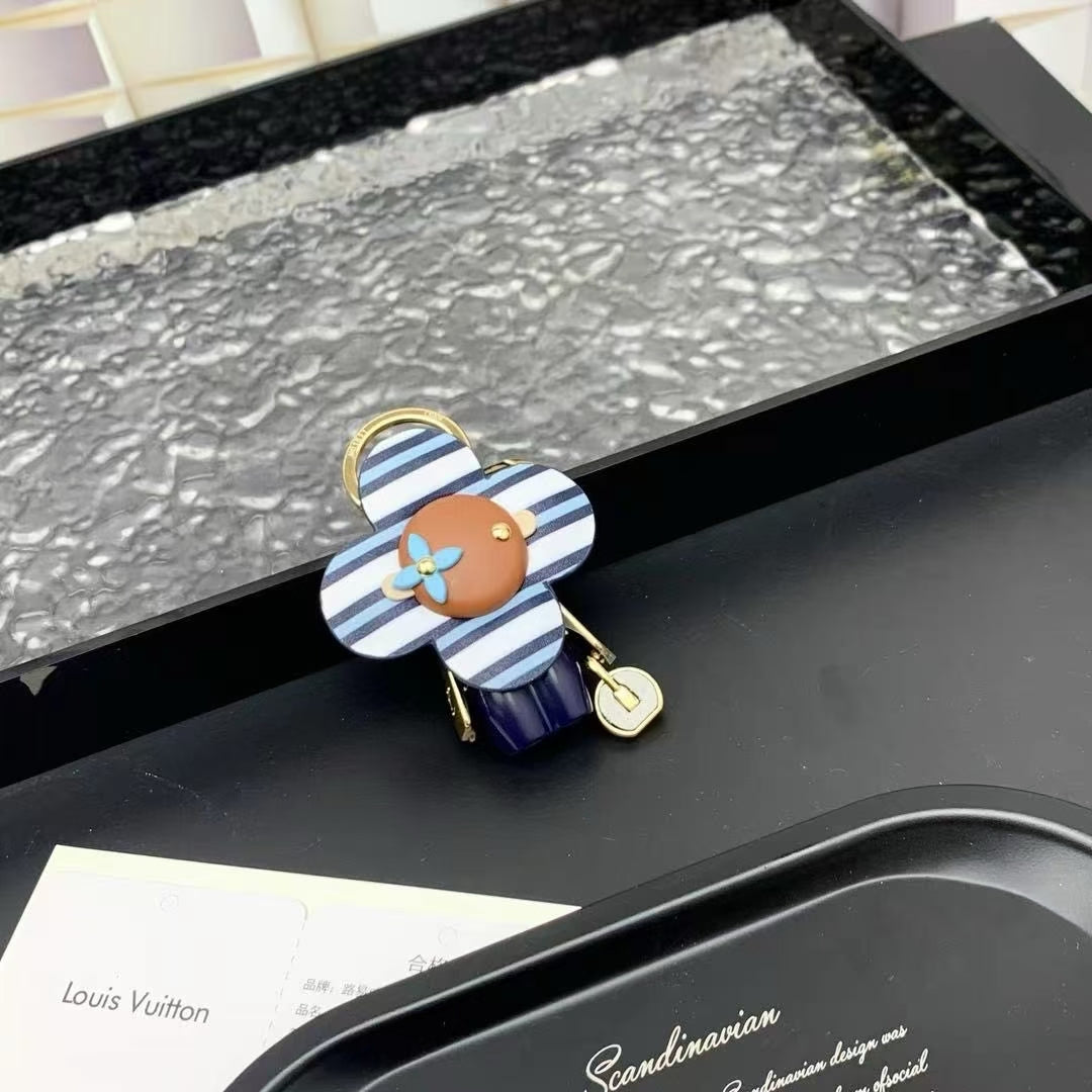 Louis Vuitton Striped Flower Padlock Keychain – Blue & White Petals with Gold Hardware