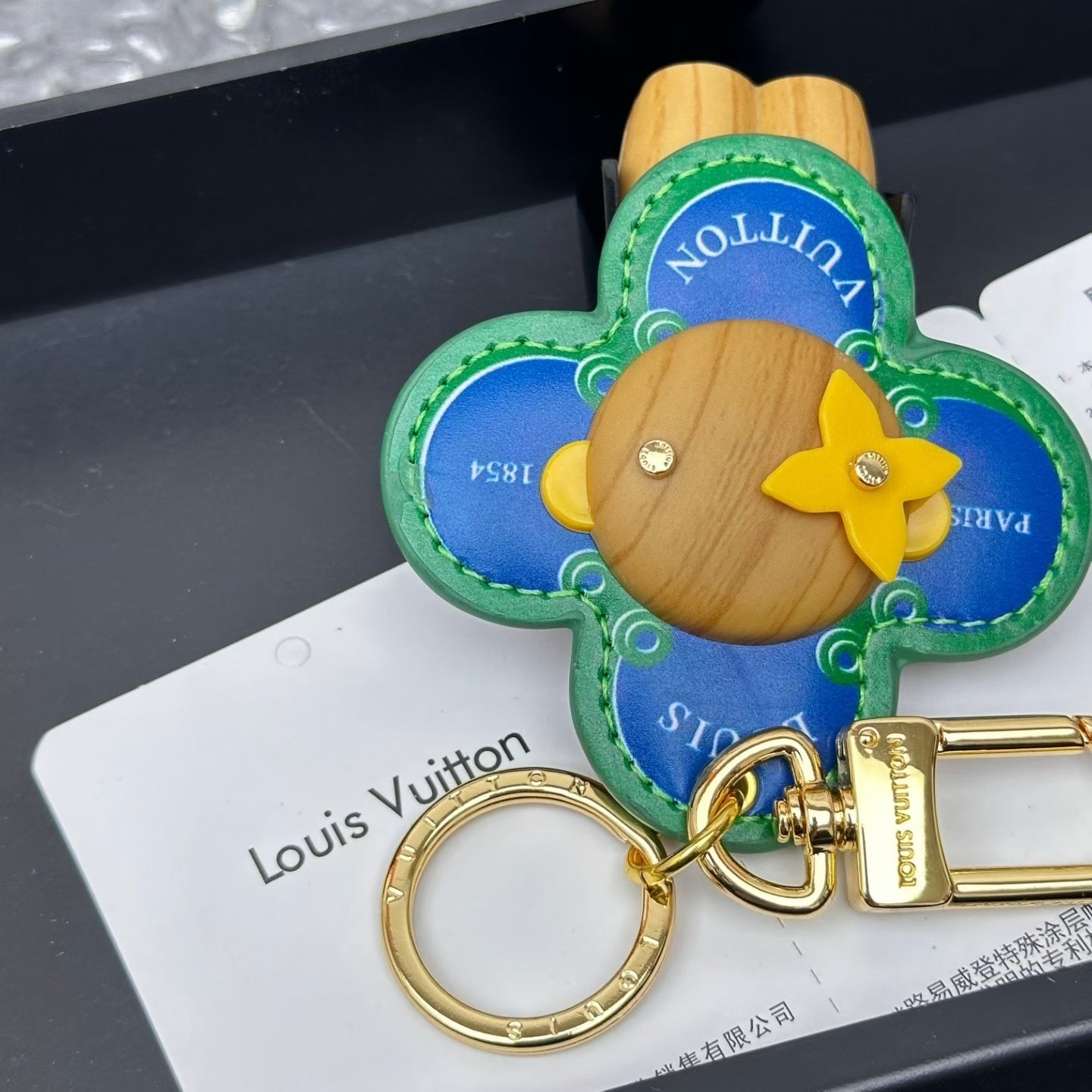 Louis Vuitton “Paris 1854” Blue Flower Keychain – Green Stitching & Yellow Accent