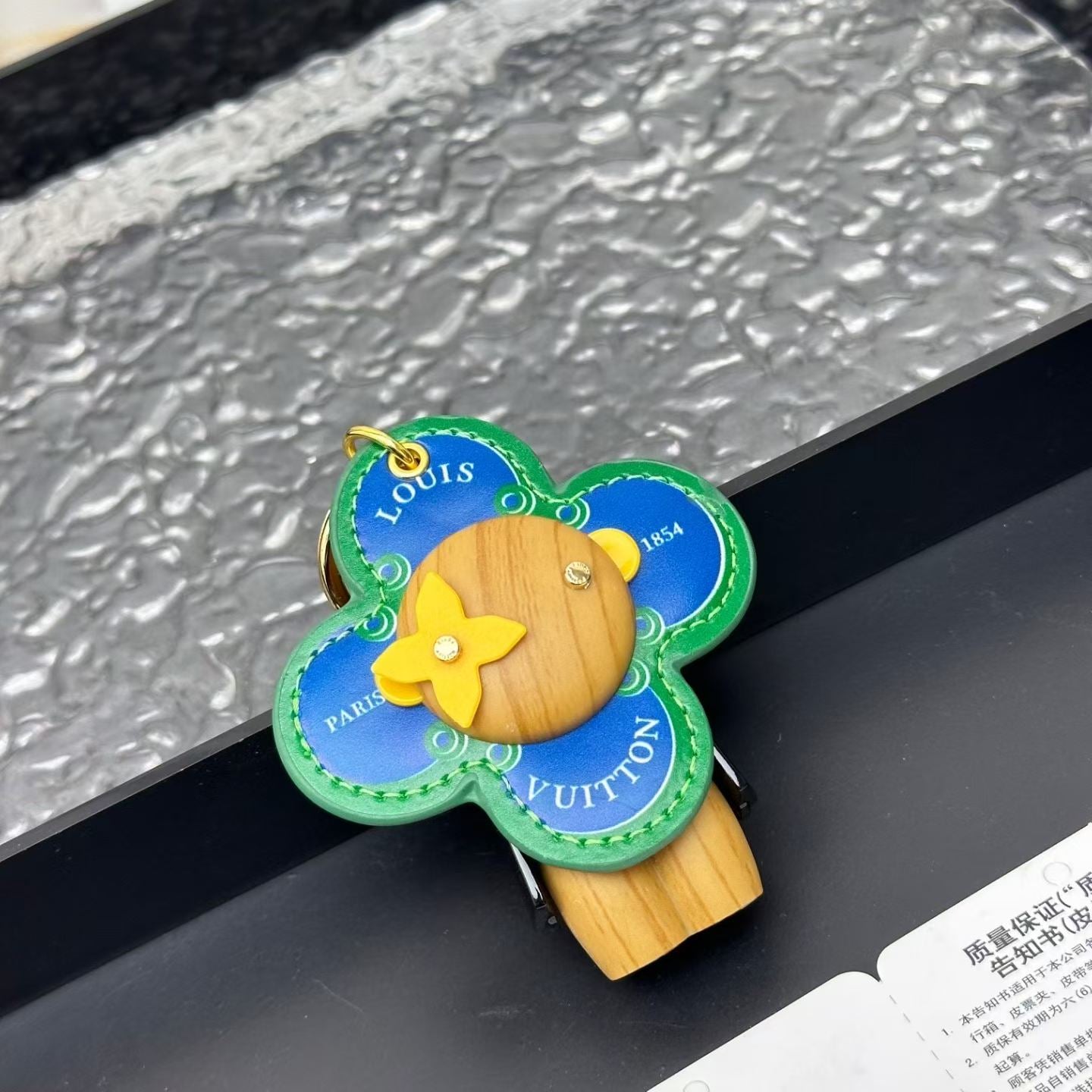 Louis Vuitton “Paris 1854” Blue Flower Keychain – Green Stitching & Yellow Accent