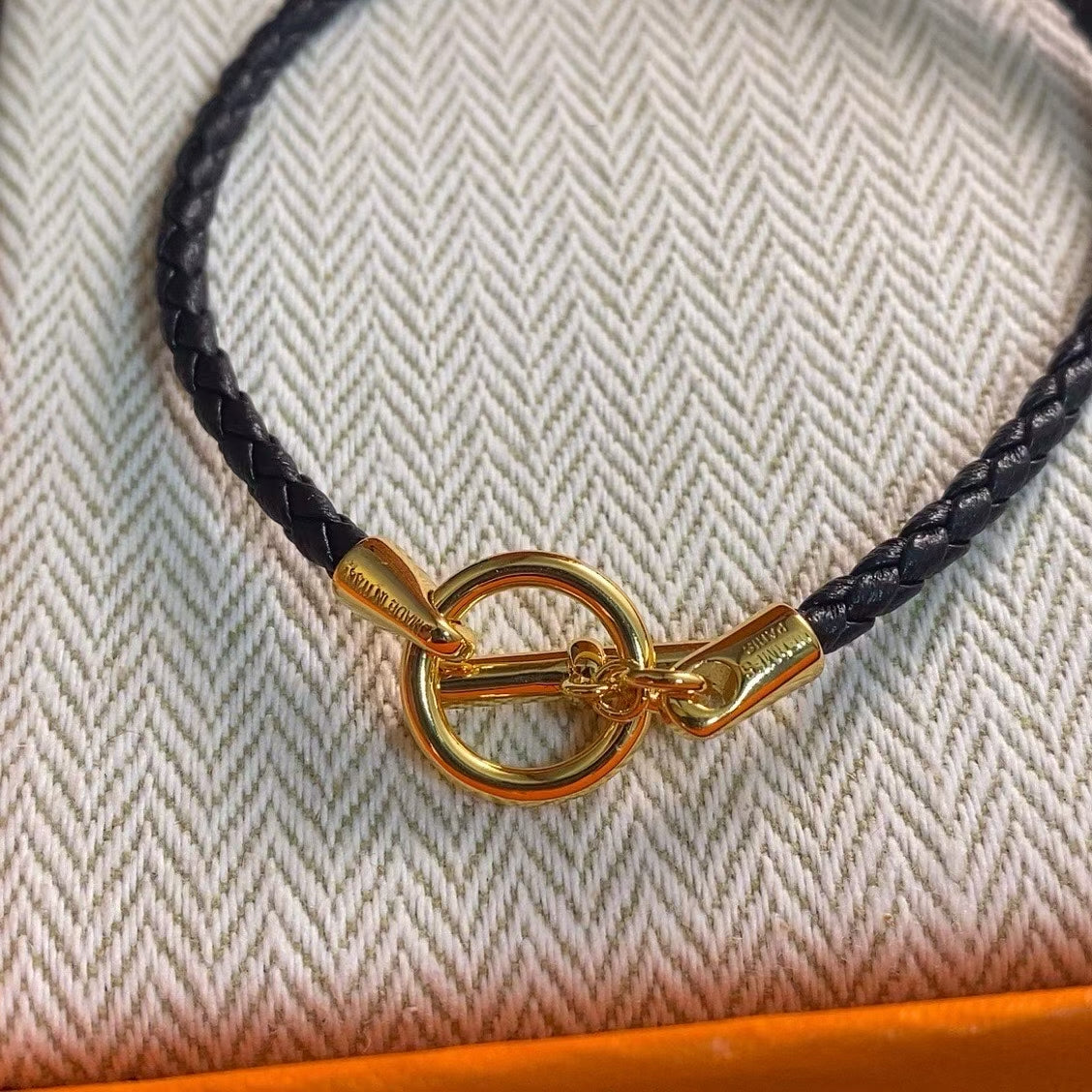 Hermès Braided Leather Toggle Bracelet – Gold & Silver Clasps