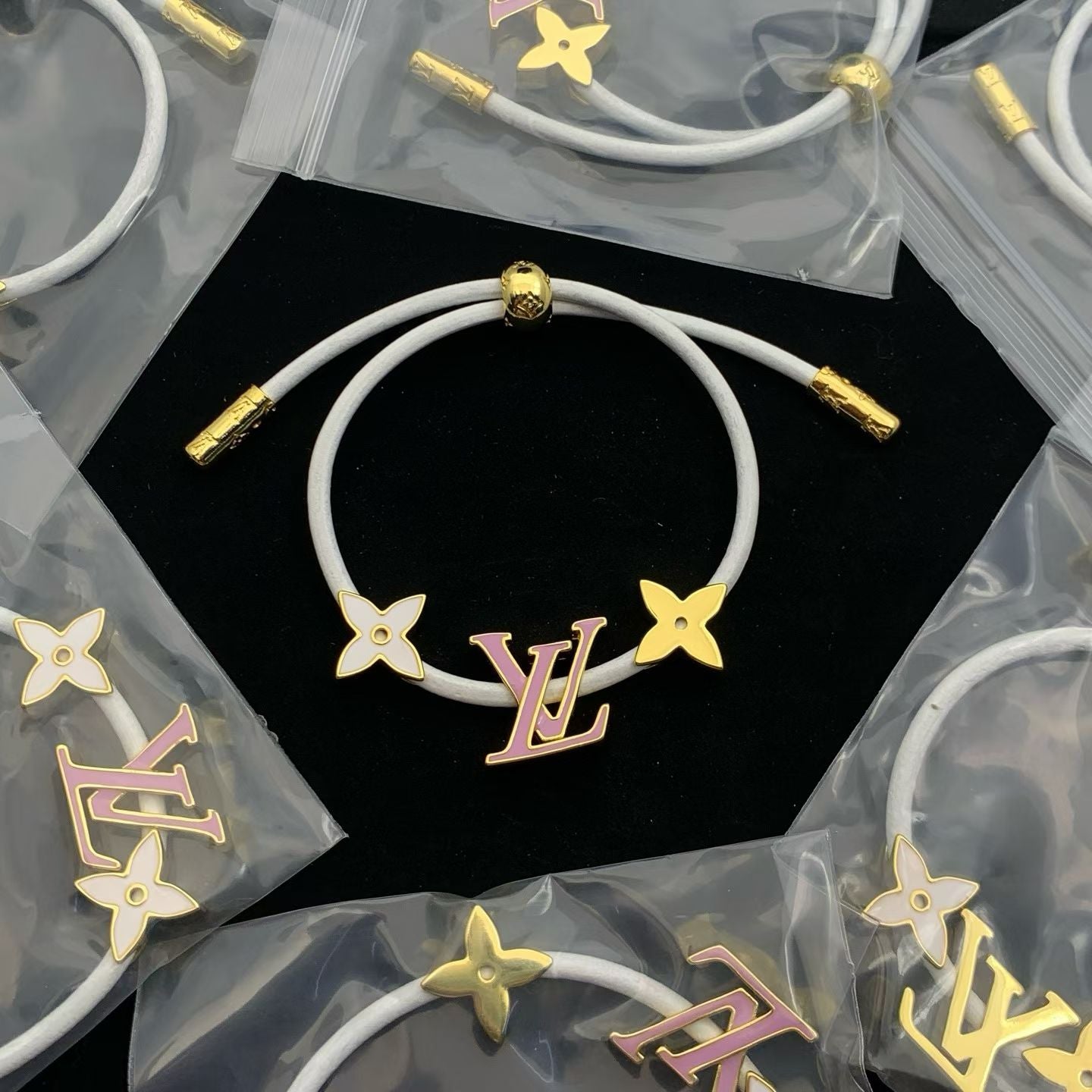Louis Vuitton White Cord Floral Charm Bracelet – Gold & Pink Accents