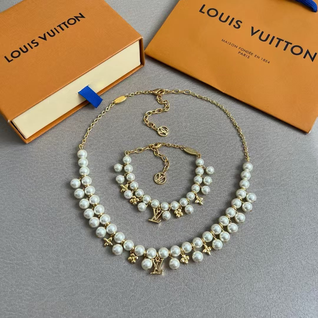 Louis Vuitton Pearl & Charm Bracelet – Gold Chain with LV Logo & Floral Motifs