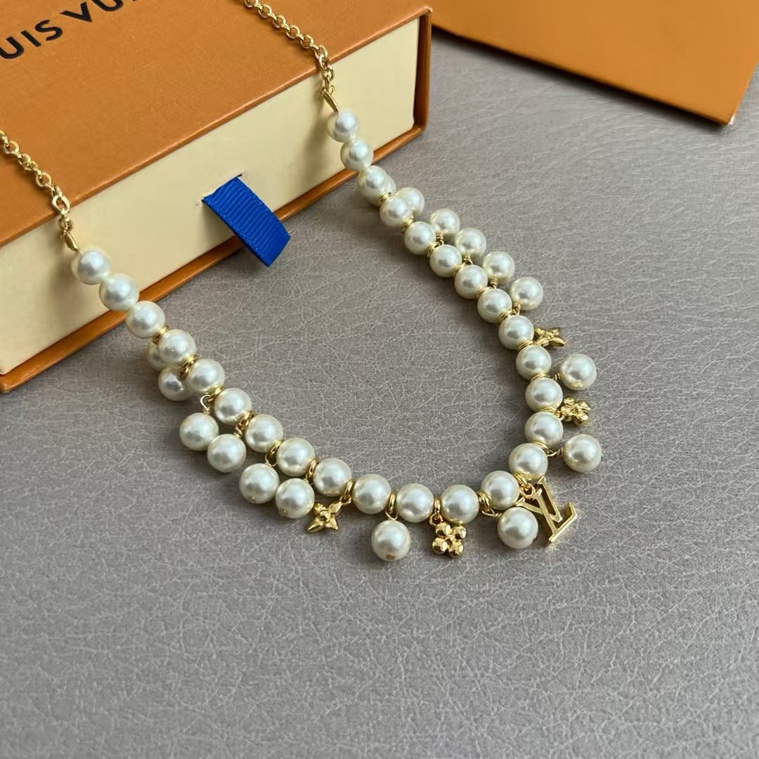 Louis Vuitton Pearl & Charm Bracelet – Gold Chain with LV Logo & Floral Motifs