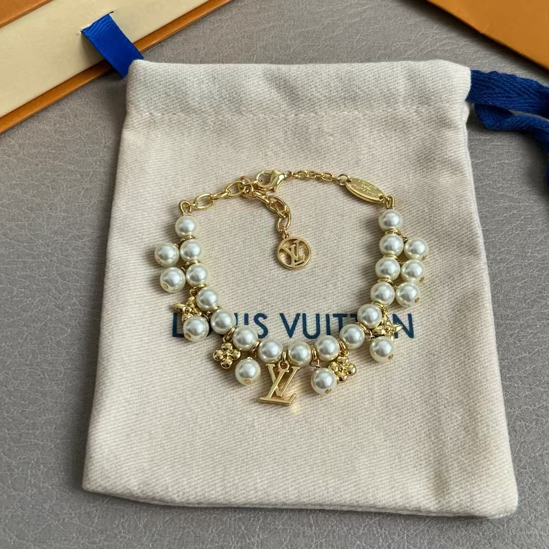 Louis Vuitton Pearl & Charm Bracelet – Gold Chain with LV Logo & Floral Motifs