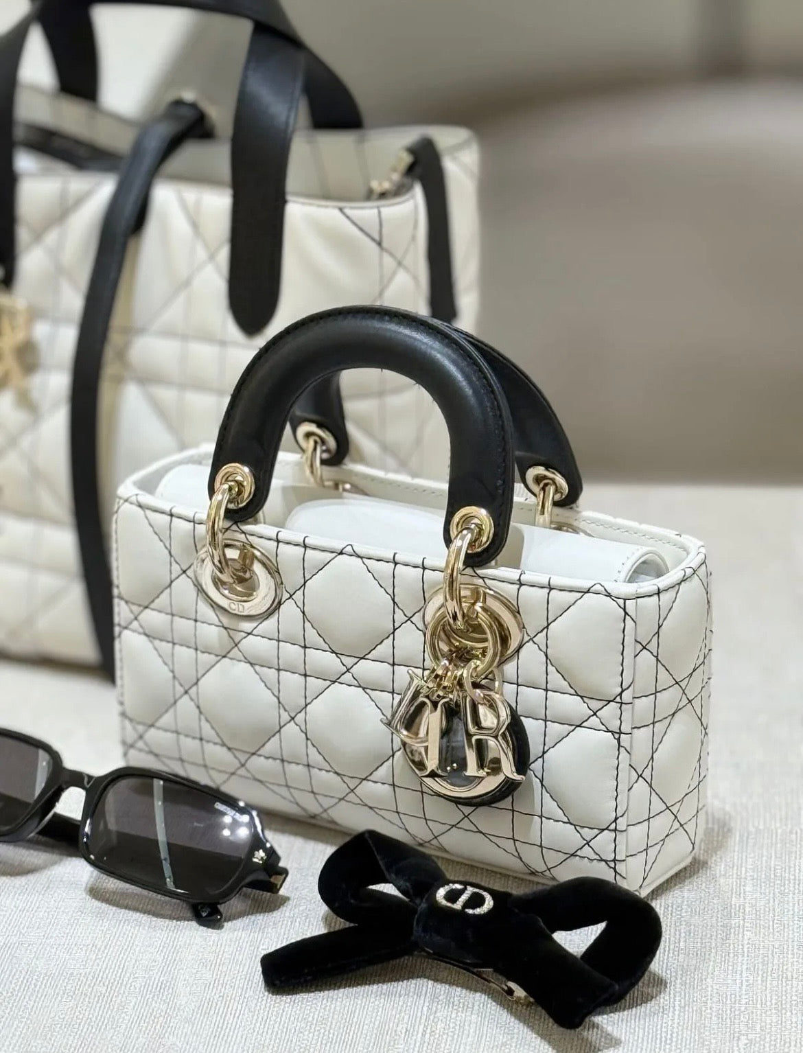 Lady Dior Handbag – White Quilted Leather with Black Handles & Silver Charm