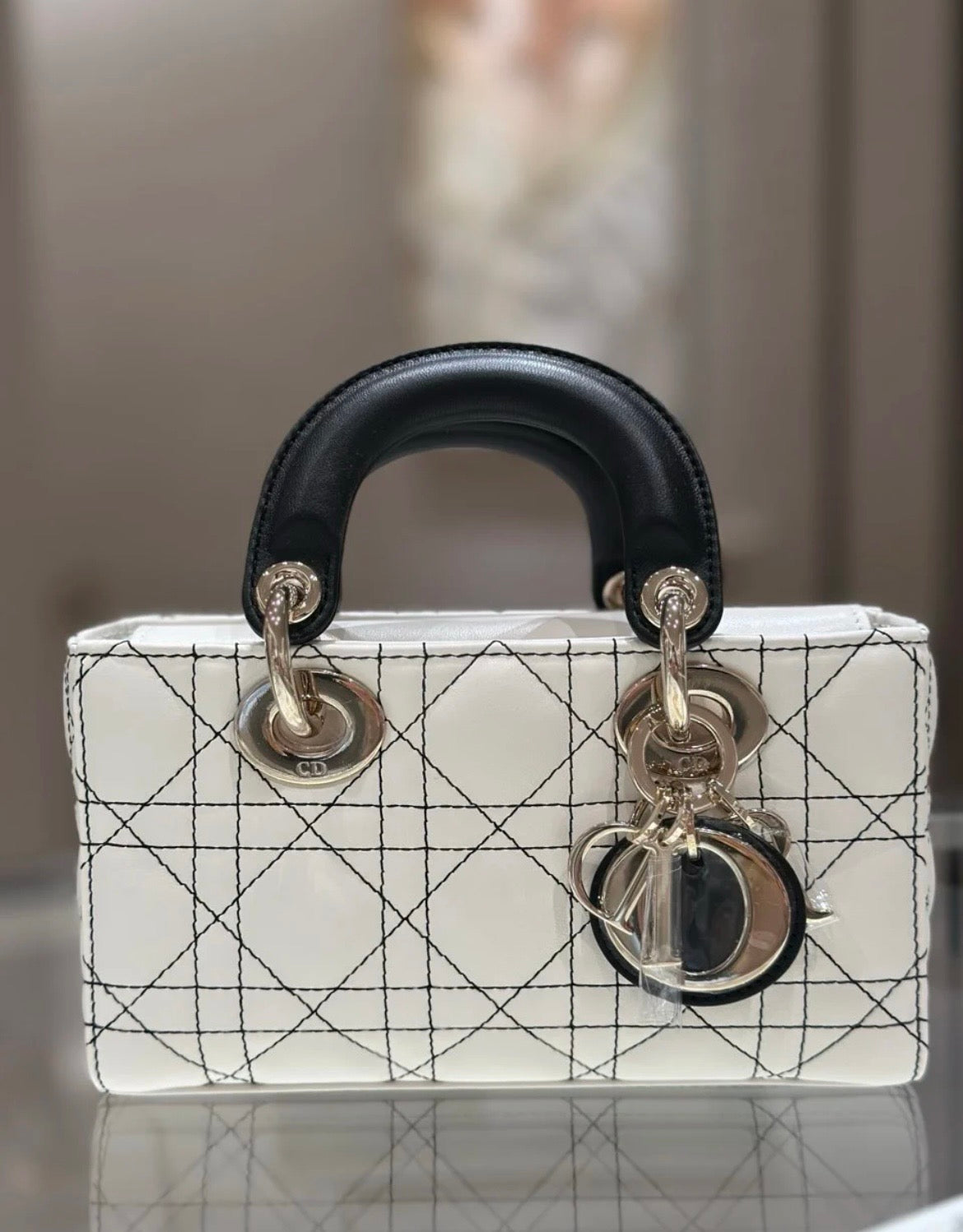 Lady Dior Handbag – White Quilted Leather with Black Handles & Silver Charm
