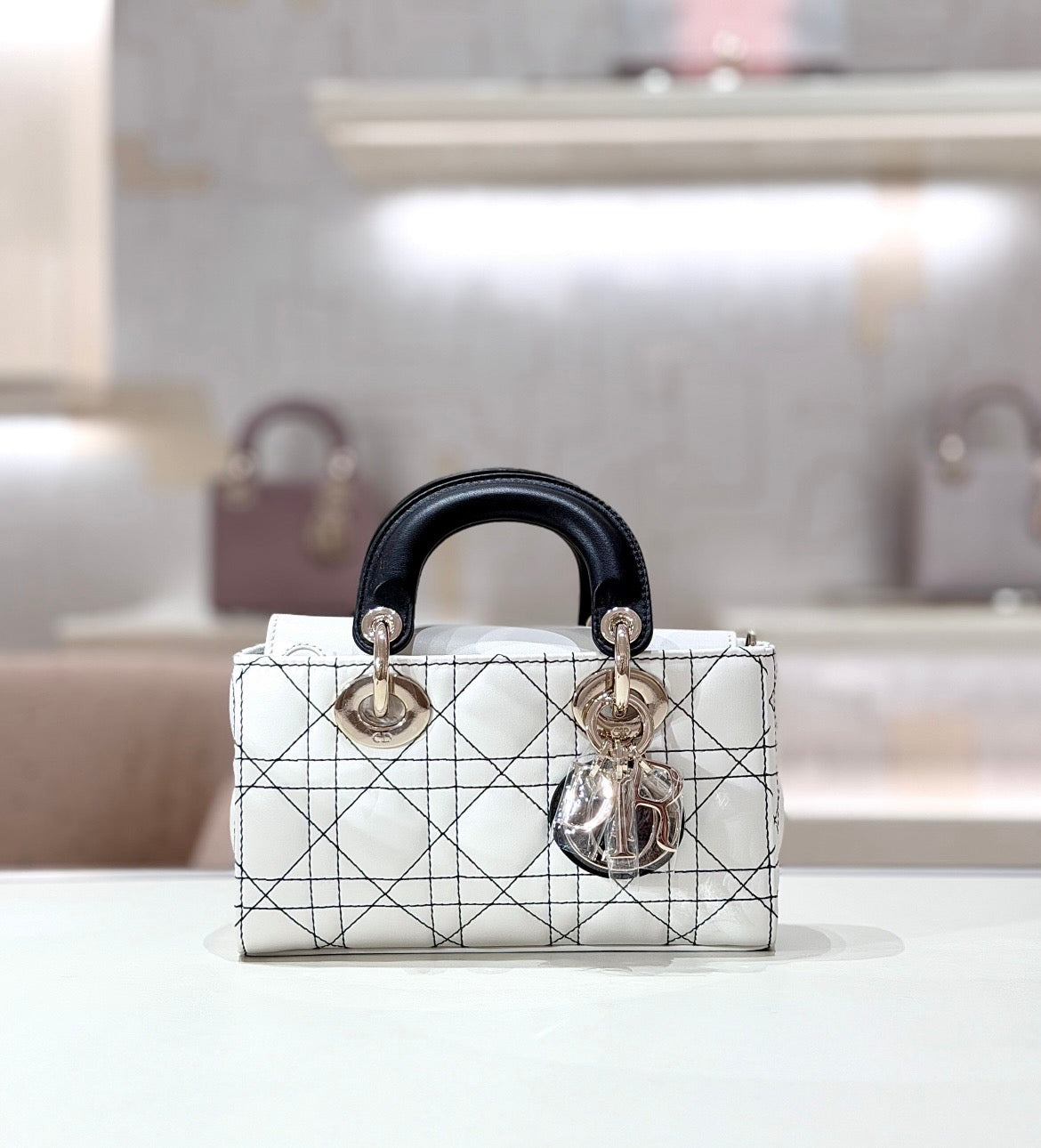Lady Dior Handbag – White Quilted Leather with Black Handles & Silver Charm
