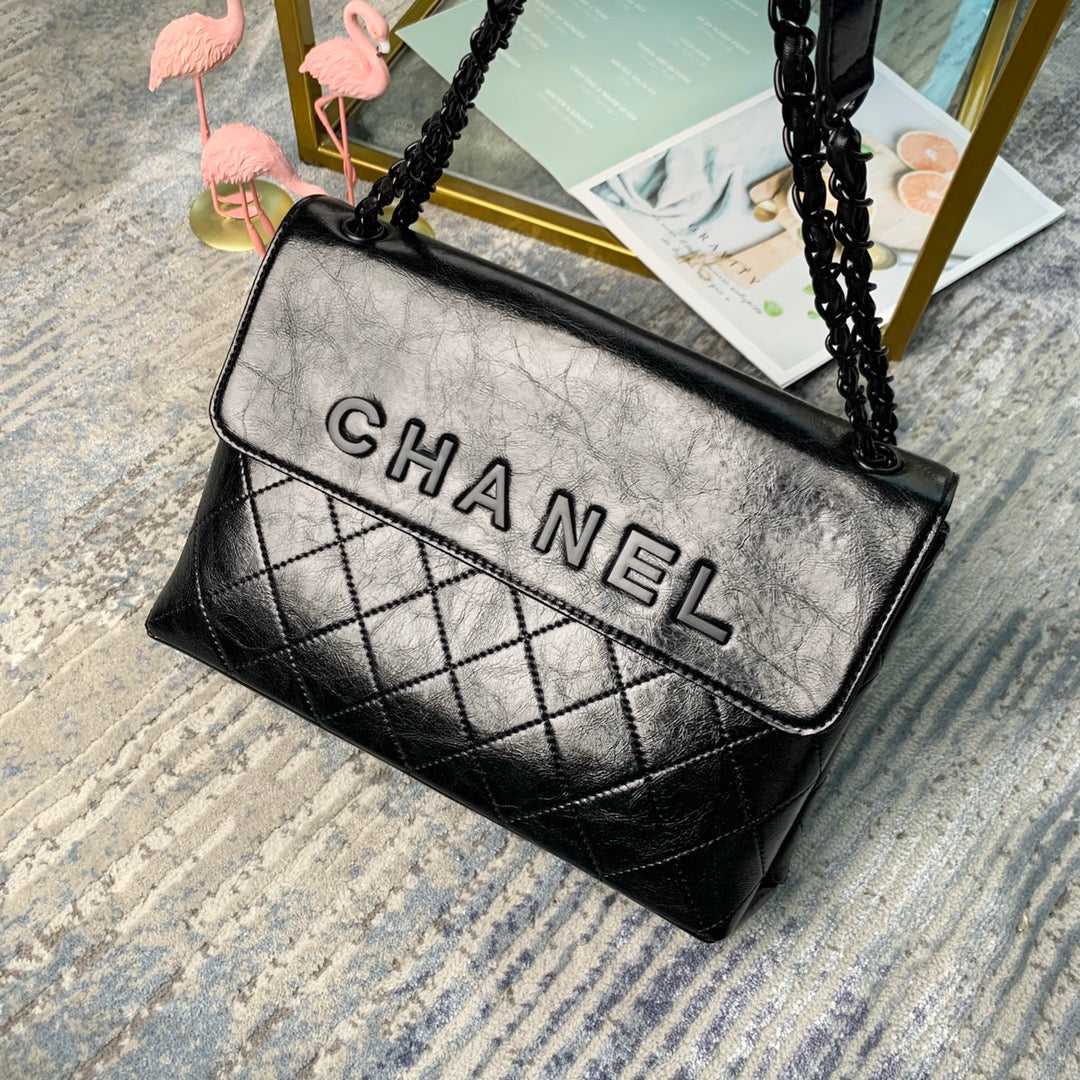 Chanel Large Flap Bag – Embossed Logo with Quilted Base