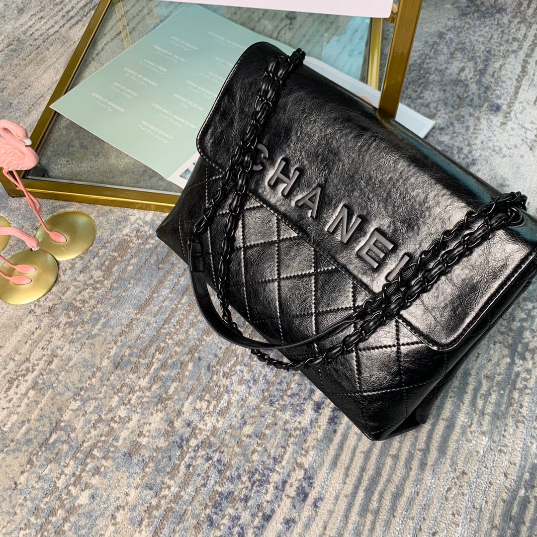 Chanel Large Flap Bag – Embossed Logo with Quilted Base