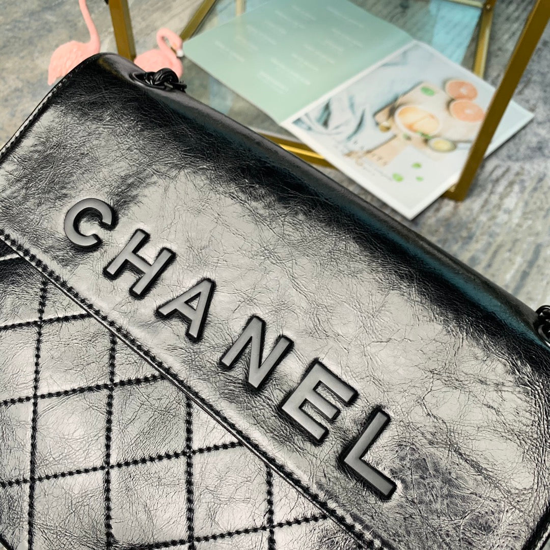 Chanel Large Flap Bag – Embossed Logo with Quilted Base