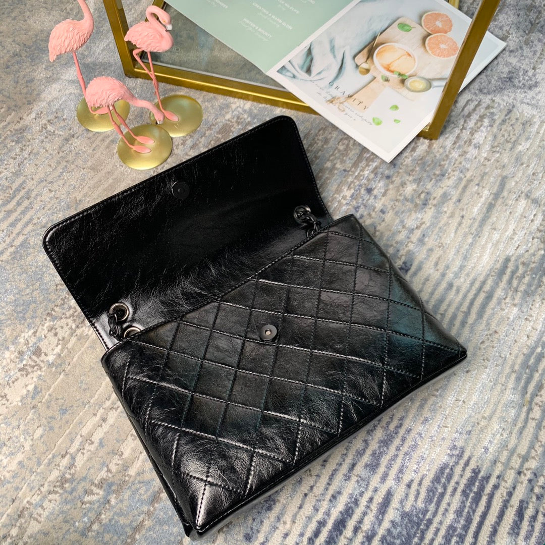 Chanel Large Flap Bag – Embossed Logo with Quilted Base