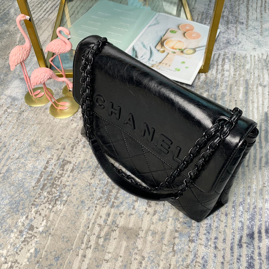 Chanel Large Flap Bag – Embossed Logo with Quilted Base