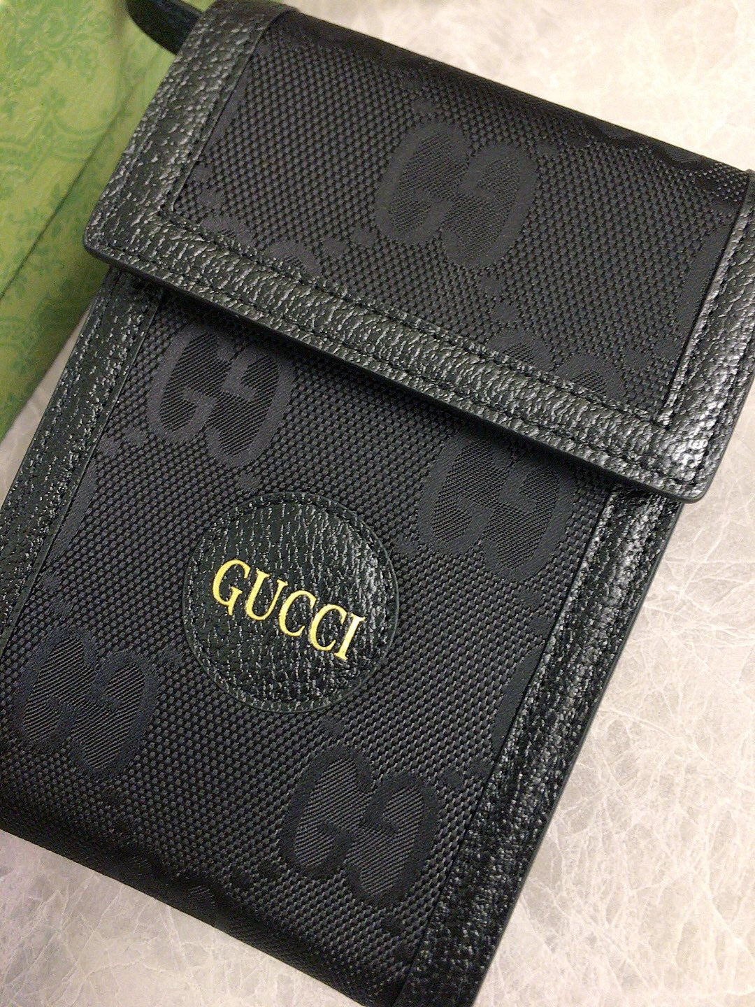 Gucci GG Embossed Leather Pouch Wallet